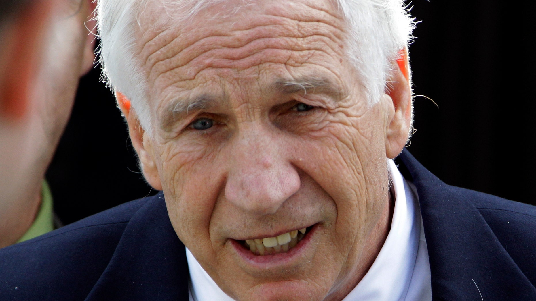June 11: Former Penn State University assistant football coach Jerry Sandusky leaves the Centre County Courthouse after the second day of testimony at his trial in Bellefonte, Pa.