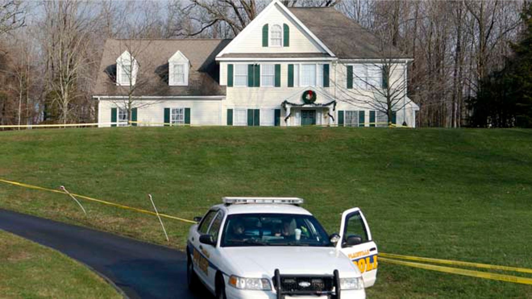 Dec. 18, 2012: A police cruiser sits in the driveway of the home of Nancy Lanza in Newtown, Conn.