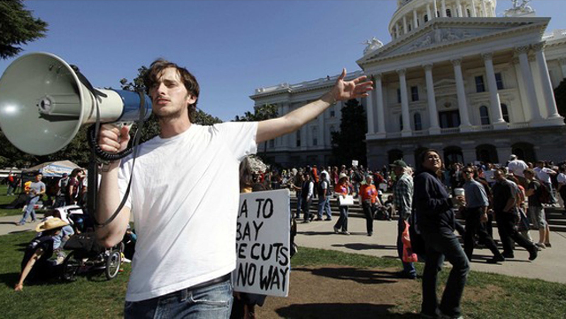 FILE: A Santa Monica College student calls to fellow protesters as they gather in Sacramento to demand higher funding for education.