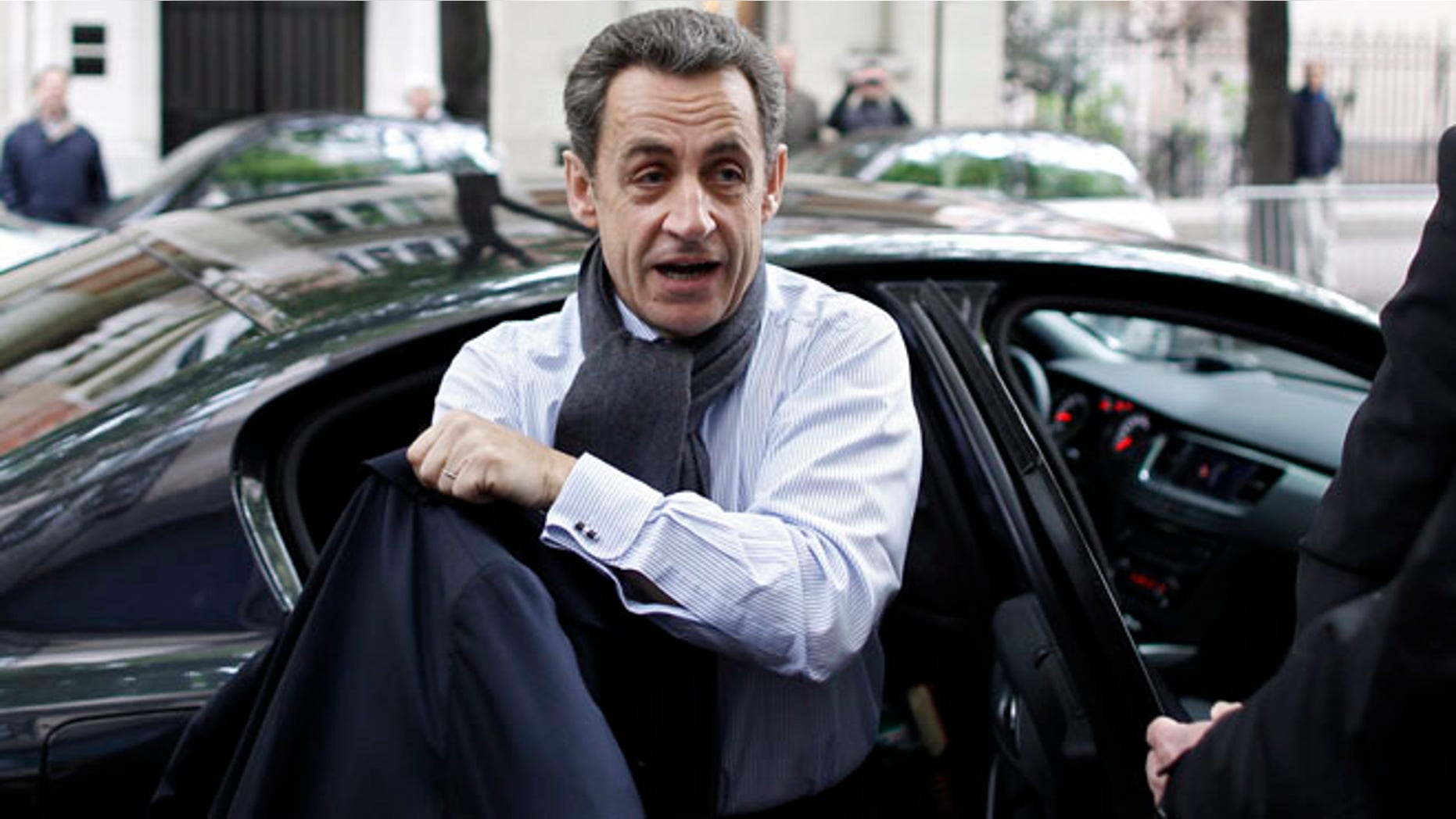April 23: French President and UMP party candidate for the elections Nicolas Sarkozy arrives at his campaign headquarters the morning after the first round of voting in Paris.