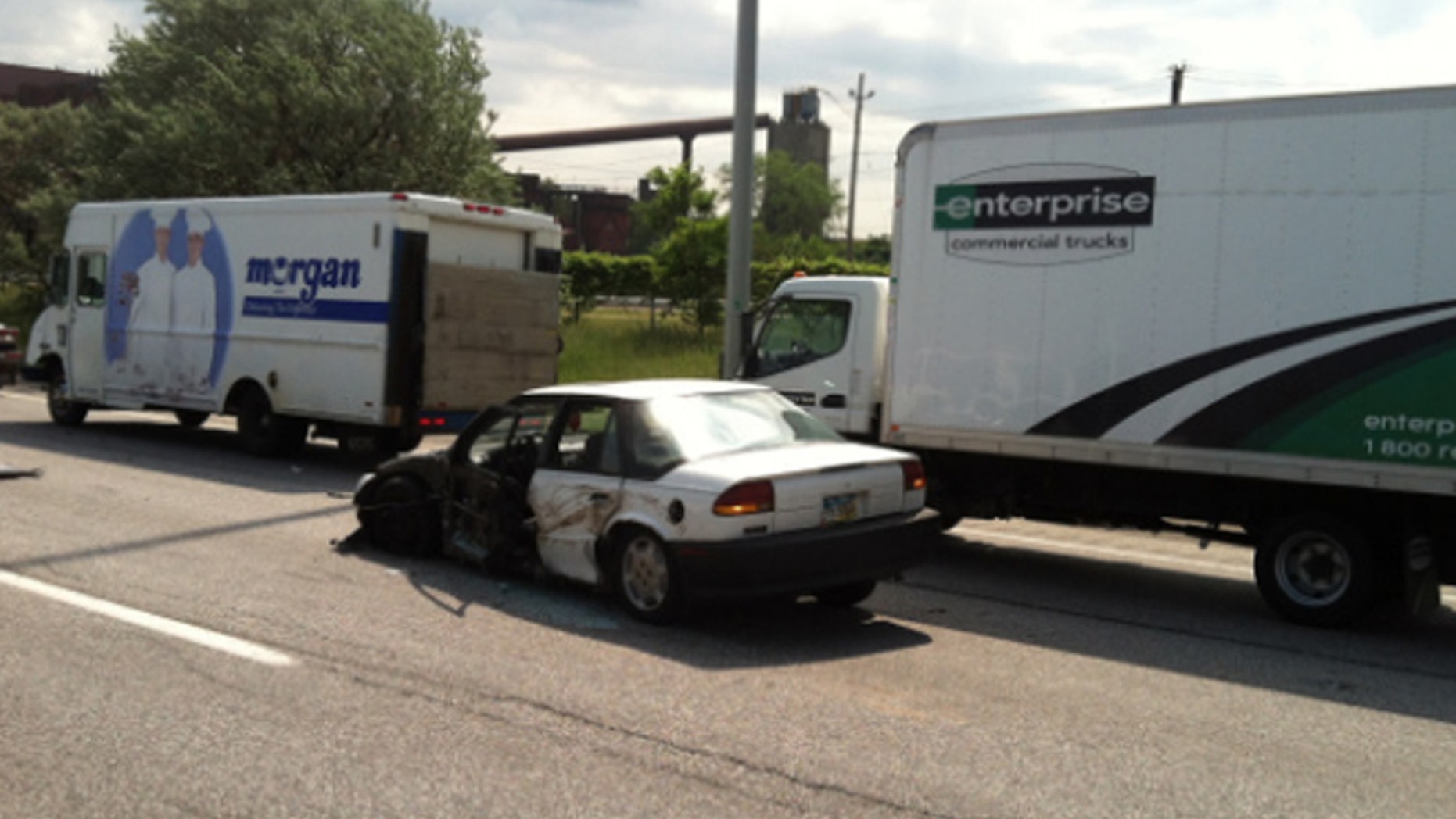 A truck slammed into the back of a Saturn, which struck and killed a man attempting to help a woman and child in a stalled car.