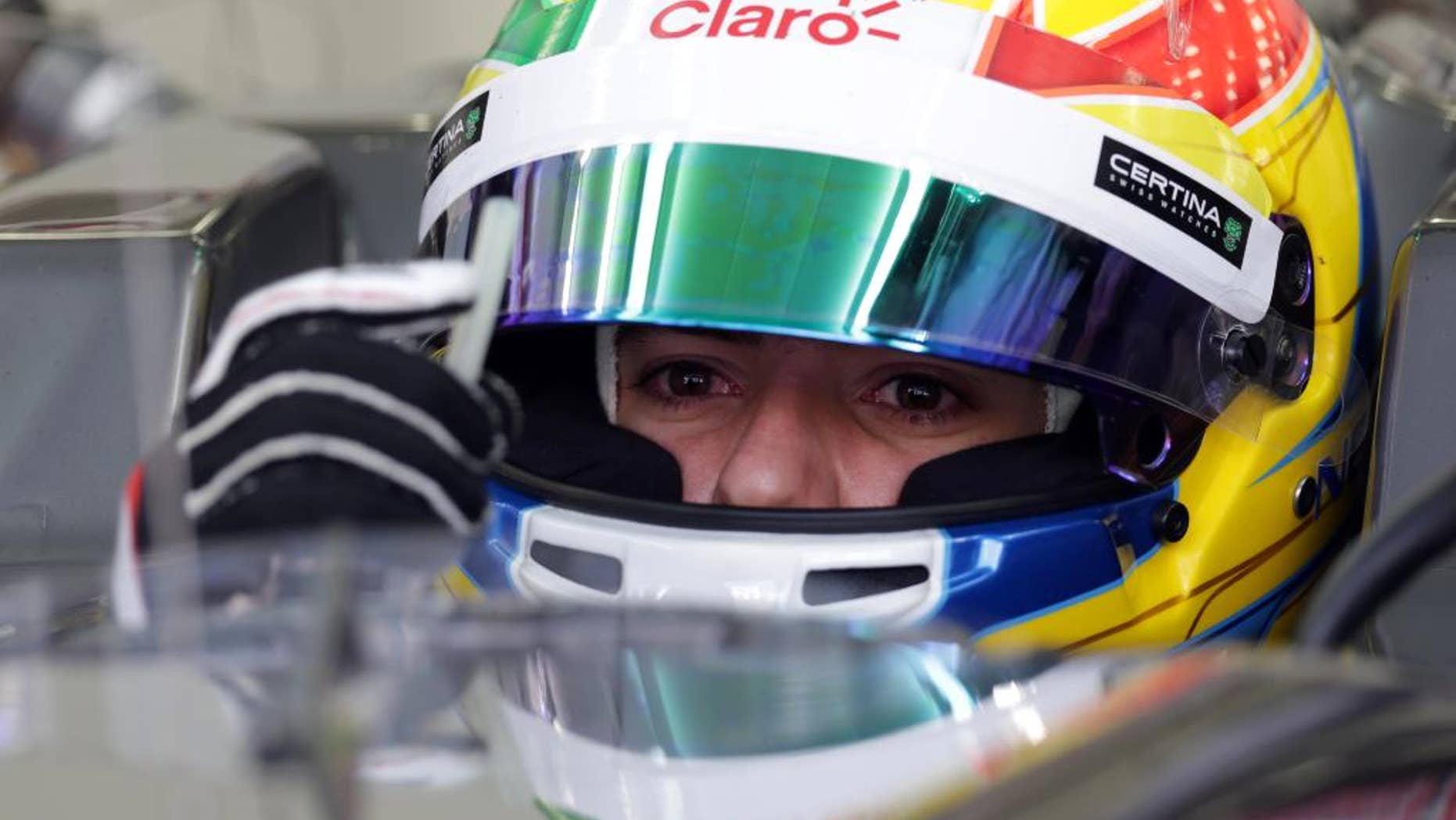 FILE - In this Feb. 20, 2014 file photo, Formula One driver Esteban Gutierrez of Sauber prepares to pull out of the garage during preseason testing at the Bahrain International Circuit in Sakhir, Bahrain. Gutierrez will compete this weekend, May 10-11, in the Spanish GP where he expects to get his first points in the F1 season. (AP Photo/Hasan Jamali, File)