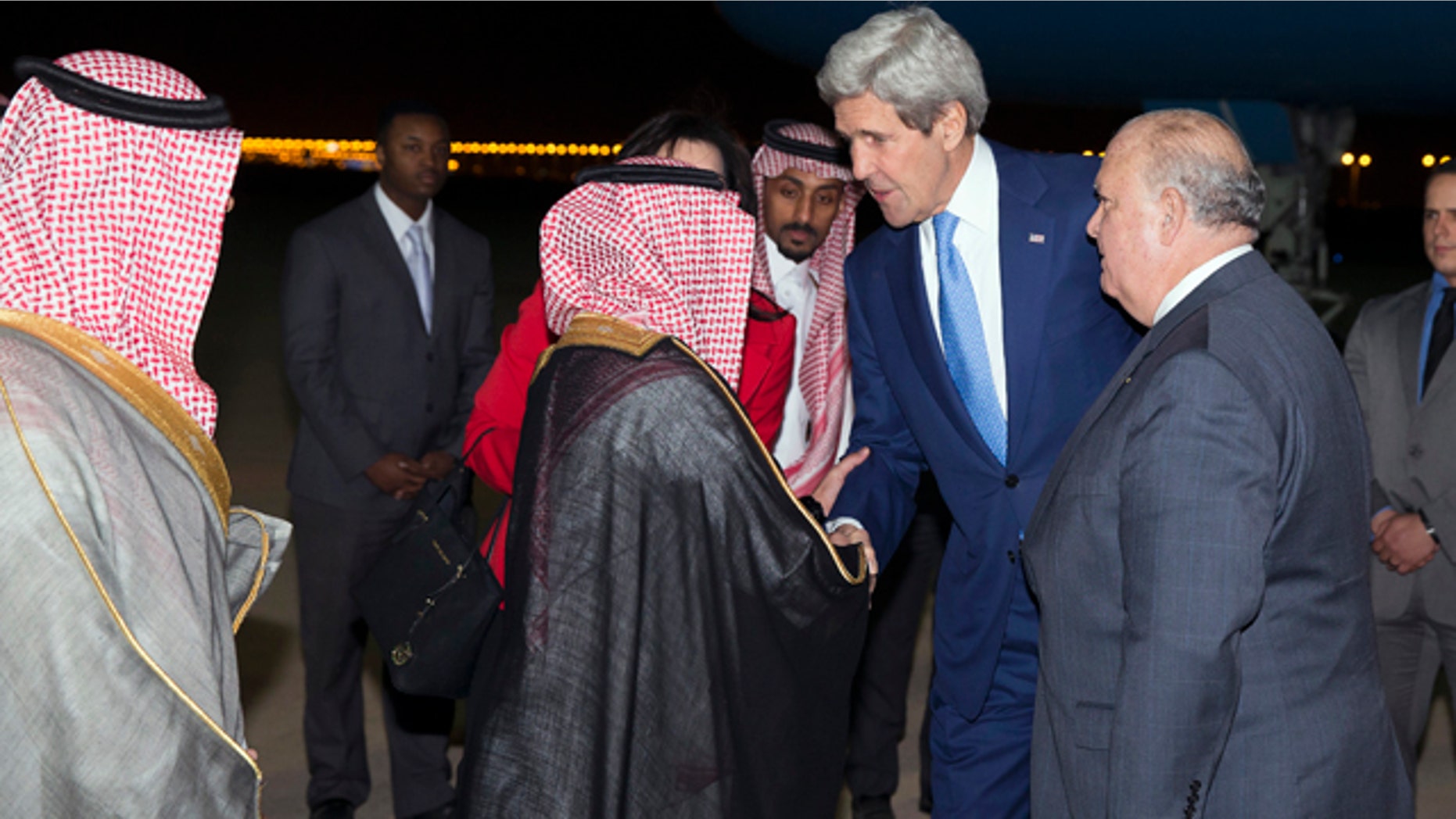 March 5, 2015: U.S. Ambassador to Saudi Arabia Joseph Westphal, right, stands with Secretary of State John Kerry as he arrives at Riyadh Air Base in Saudi Arabia. (AP Photo/Evan Vucci)