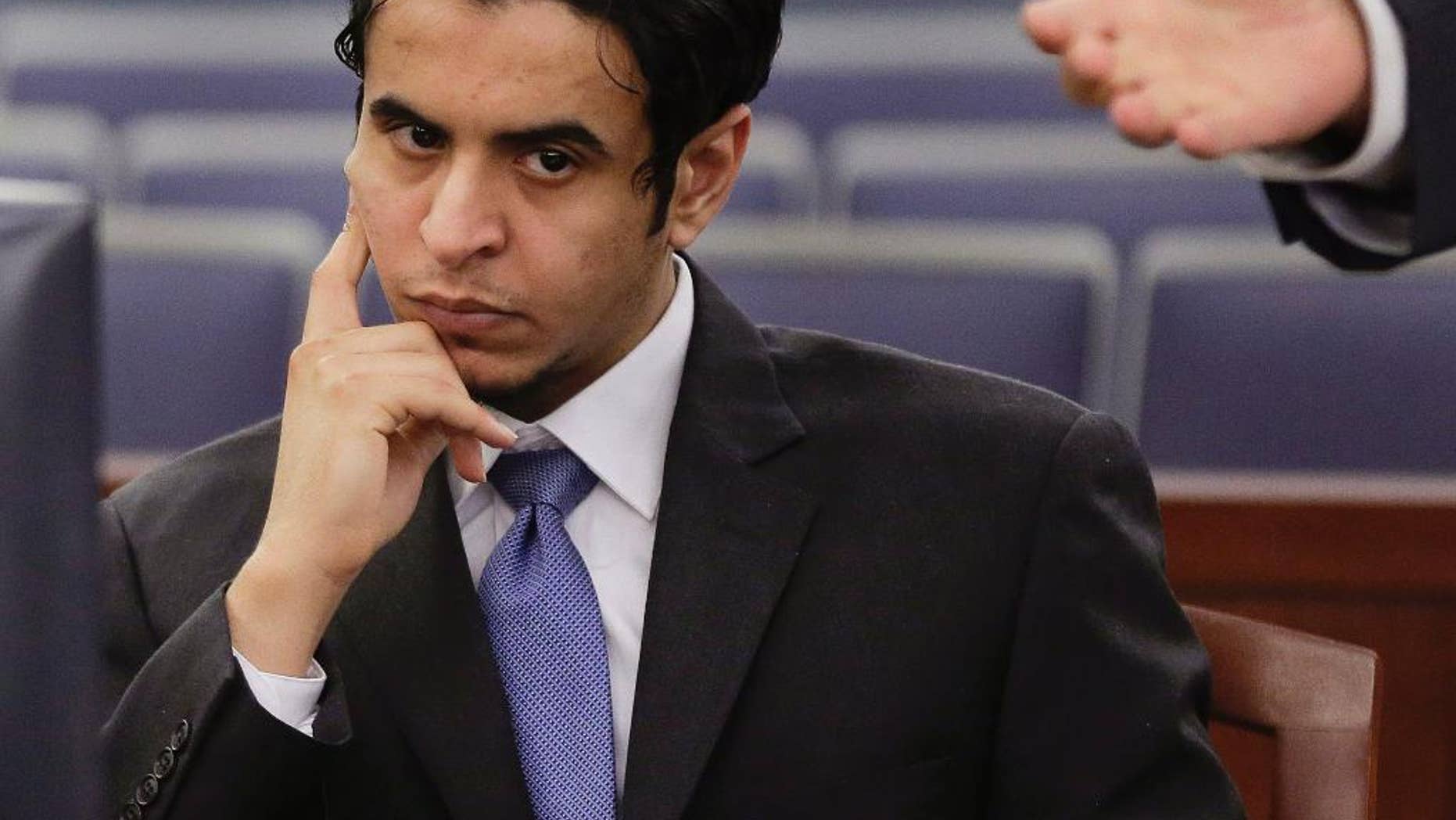 FILE - In this Wednesday, Oct. 23, 2013, file photo, Defendant Mazen Alotaibi, listens to comments by his defense attorney, Don Chairez during the jury selection process for his trial at Justice Court in Las Vegas. Sentencing is scheduled Wednesday, Jan. 28, 2015 for Alotaibi, a 25-year-old Saudi Arabian air force sergeant who was found guilty of kidnapping and sexually assaulting a 13-year-old boy at a Las Vegas Strip hotel on New Year's Eve 2012. (AP Photo/Julie Jacobson, File)