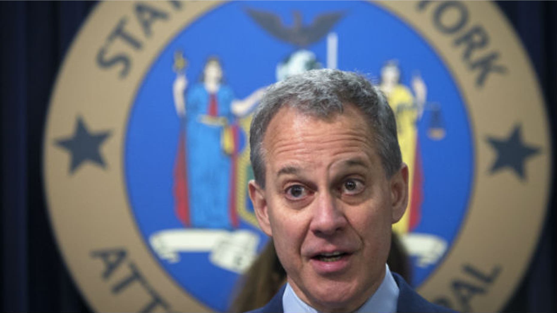 New York State Attorney General Eric Schneiderman speaks during a news conference in the Manhattan borough of New York in this file photo dated August 21, 2014. REUTERS/CARLO ALLEGRI