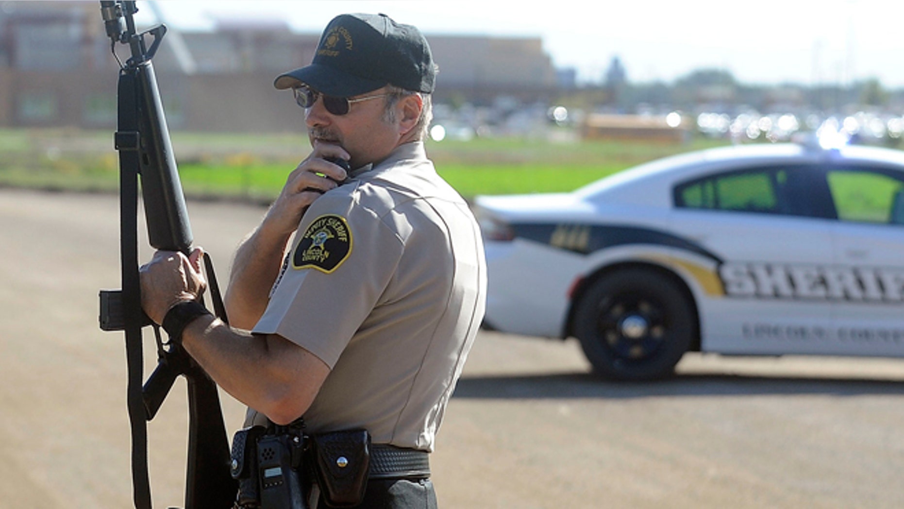 Lincoln County Sgt. Sheriff Terry Anderson guards the entrance of Harrisburg High School.
