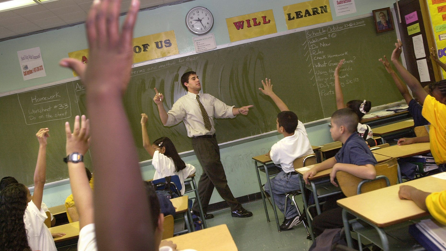 379693 07: Teacher David Nieder of "Knowledge is Power Program" (KIPP) Academy takes questions from his class October 4, 2000 in The Bronx, New York. The Knowledge Is Power Program educates 200 middle-school students, mostly poor black and Latino neighborhood children, housed in a hallway on the fourth floor of a regular Bronx public schooI. Because of strict discipline where each student gets two hours of homework a night and a regular school day runs nine-and-a-half-hours, including Saturdays and throughout the summer, test scores are the highest in the Bronx. Governor George Bush of Texas, where another KIPP school is run, singled out KIPP for praise during his presidential debate against Vice President Al Gore. (Photo by Chris Hondros/Newsmakers)