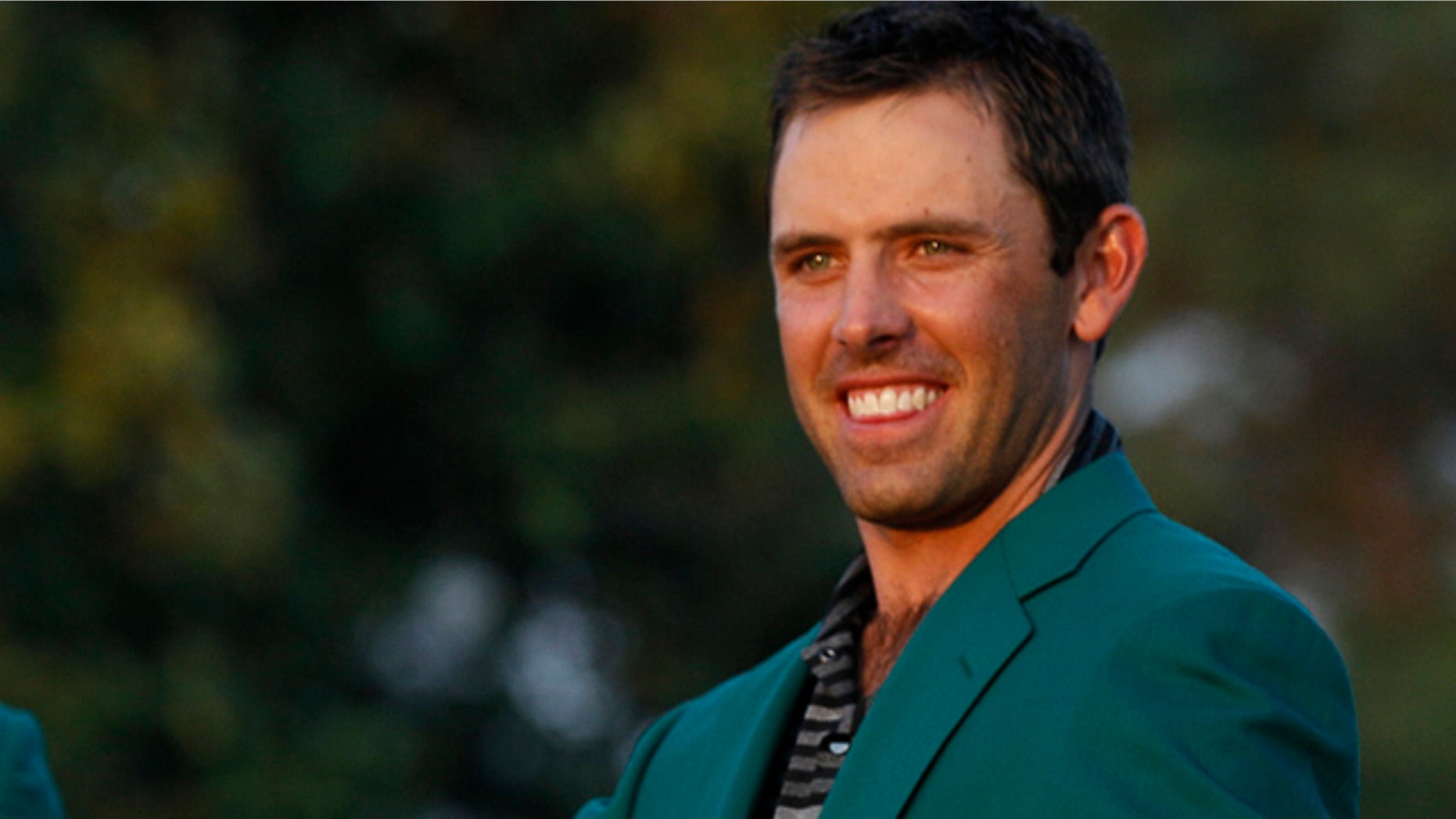 April 10, 2011: Charl Schwartzel of South Africa shows off his green jacket after winning the Masters golf tournament.