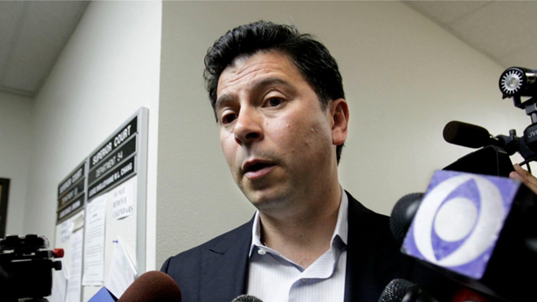 FILE - In this July 11, 2011 file photo, former Assembly Speaker Fabian Nunez, D-Los Angeles, talks to reporters after the first hearing in a lawsuit against the state of California and former Gov. Arnold Schwarzenegger for reducing the manslaughter sentence for Nunez's son, who was one of the men convicted in the 2008 slaying of a 22-year-old college student, outside a Sacramento County Superior Courtroom. A Sacramento County judge on Friday, Sept. 7, 2012 will hear arguments over whether former Gov. Arnold Schwarzenegger violated California law when he reduced the sentence. (AP Photo/Rich Pedroncelli, File)