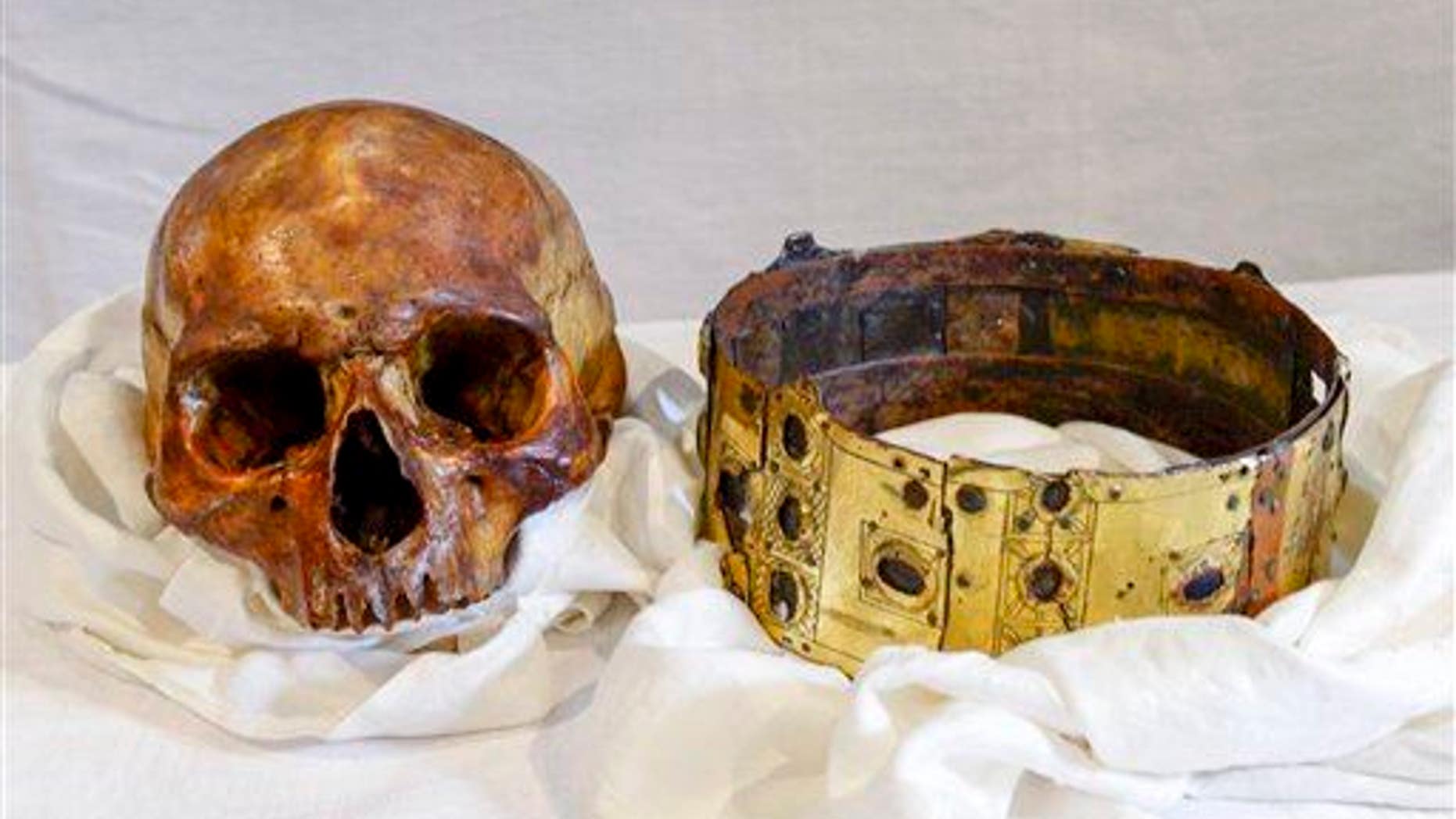 The skull and crown of Swedish 12th century King Erik IX are displayed in Uppsala Cathedral in Sweden on Wednesday, April 23, 2014.