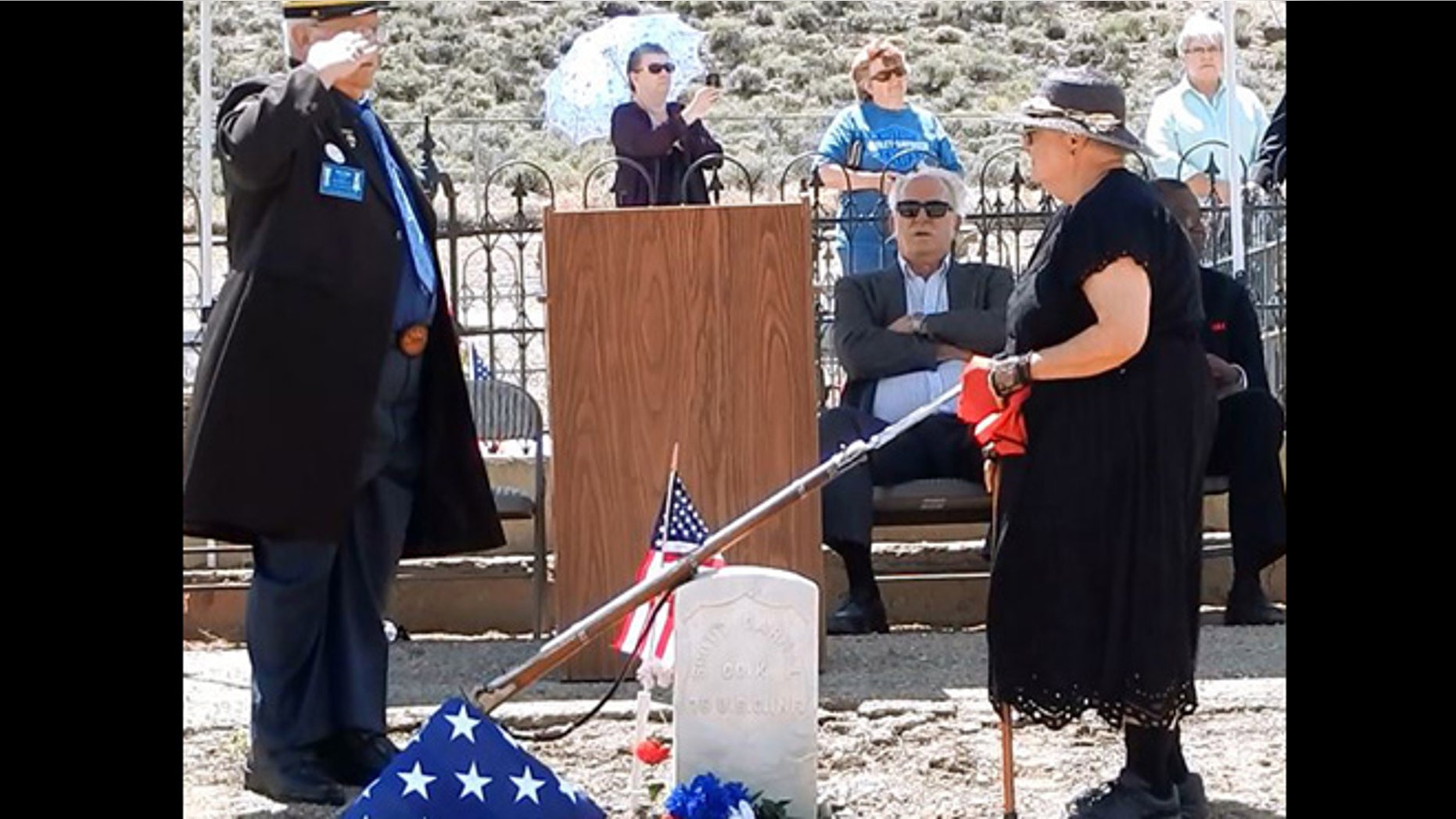 June 7, 2015: John Riggs of the Sons of Union Veterans of the Civil War, left, and Linda Clements of the Historical Society of Dayton Valley pay their respects to Pvt. Scott Carnal of the 1st Kansas Colored Infantry during a ceremony at his grave in Dayton, 30 miles south of Reno, Nev.