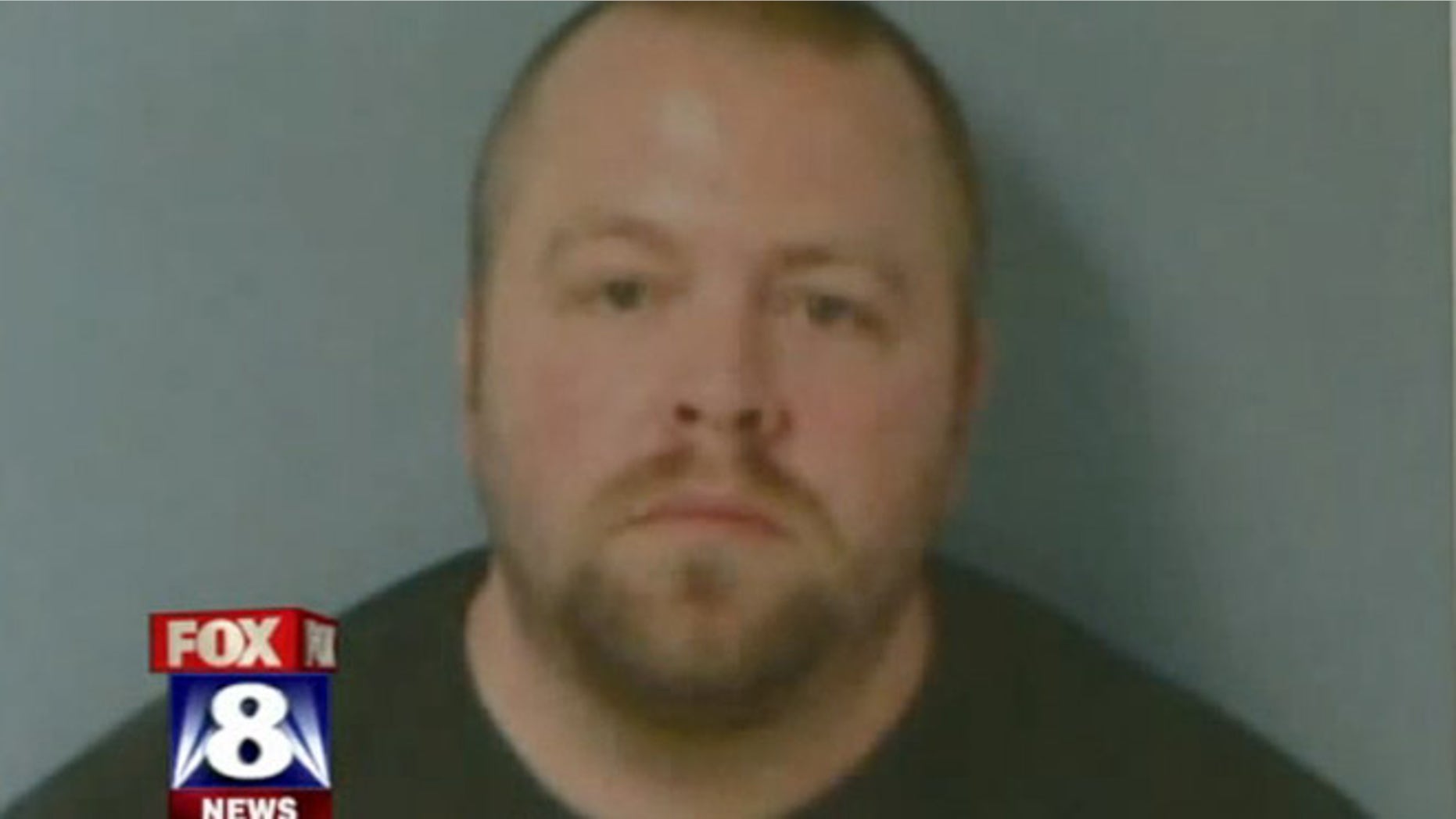 Scott Smith, 37, was arrested and charged after police discovered a loaded 9 mm handgun, two additional ammo magazines and four knives, police say.