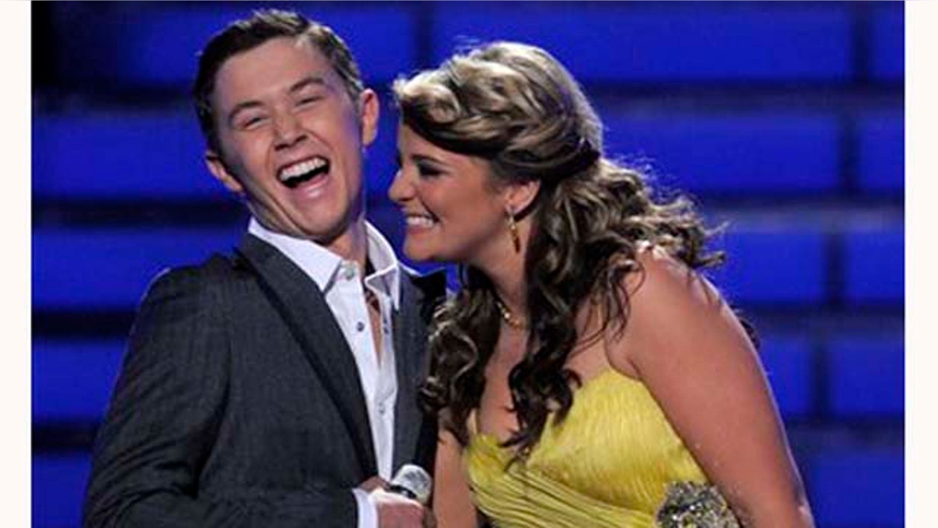 Finalists Scotty McCreery, left, and Lauren Alaina are seen onstage before the winner is announced at the "American Idol" finale on Wednesday, May 25, 2011, in Los Angeles. (AP Photo/Chris Pizzello)