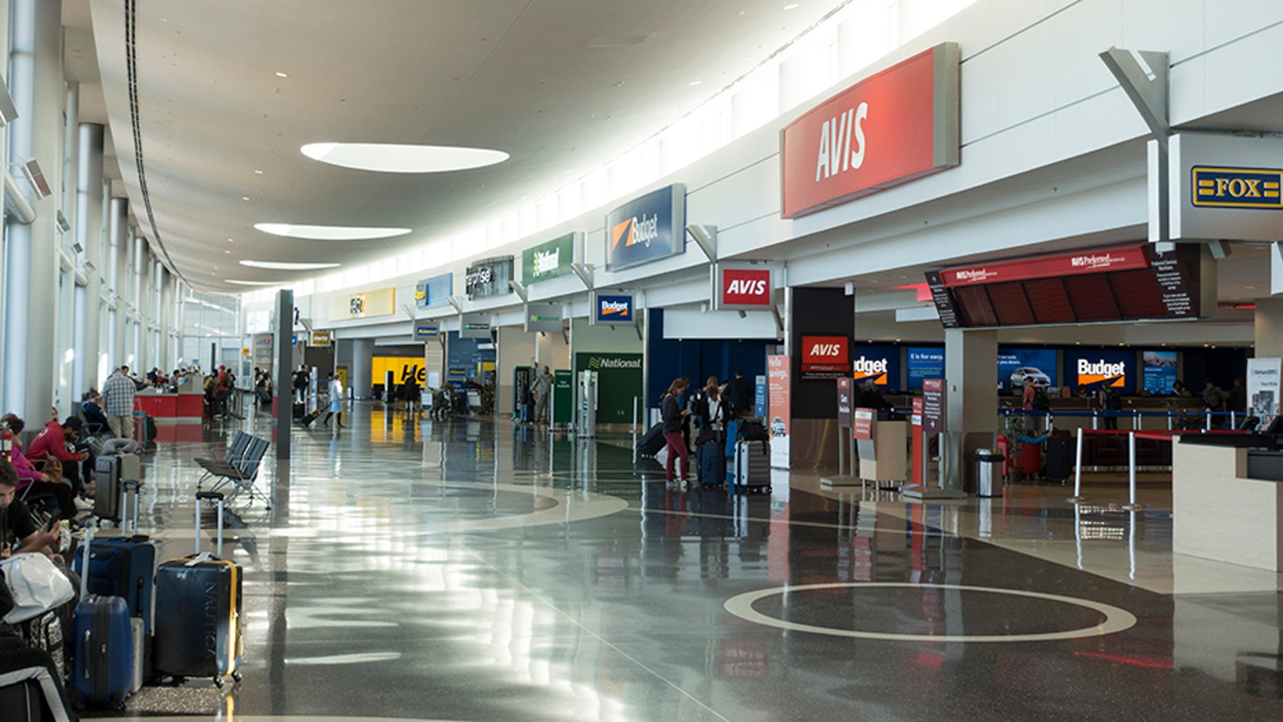 Seattle, USA - September 27, 2017. Travelers at the car rental center of Seattle-Tacoma International Airport. The airport is a major air transportation hub serving the Seattle metropolitan area in the State of Washington.