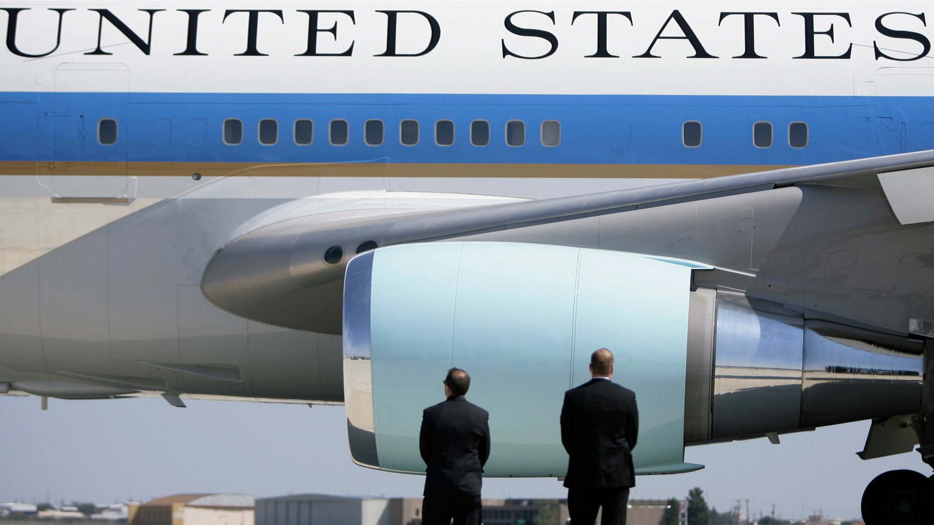 In this Saturday, Oct. 4, 2008 photo, Secret Service agents watch as Air Force One departs Midland International Airport with President Bush and first lady Laura Bush aboard in Midland, Texas. The Secret Service has been tarnished by a prostitution scandal that erupted April 13, 2012 in Colombia involving 12 Secret Service agents, officers and supervisors and 12 more enlisted military personnel ahead of President Barack Obama's visit there for the Summit of the Americas. (AP Photo/Matt Slocum)