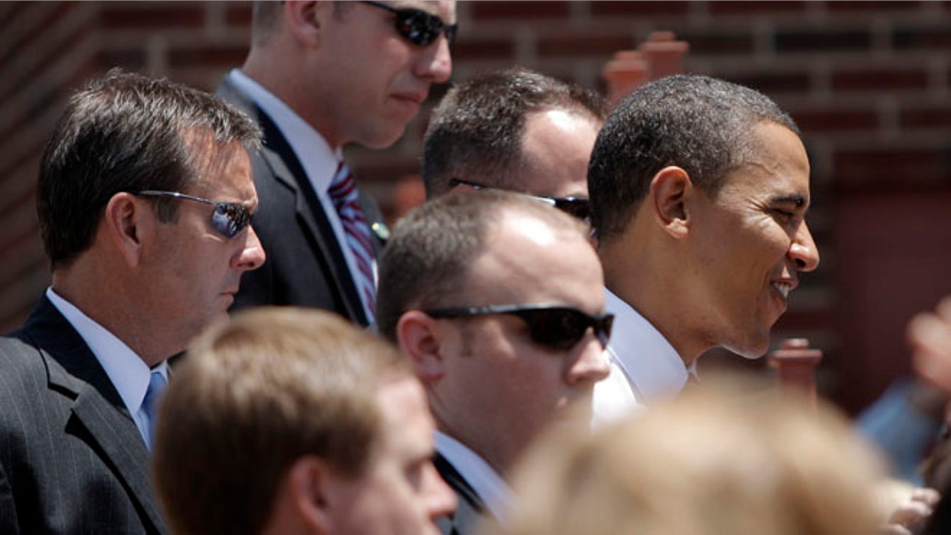 FILE - In this Monday, June 30, 2008 file photo, Secret Service agents surround Democratic presidential candidate Sen. Barack Obama as he greets supporters in Independence, Mo. The Secret Service has been tarnished by a prostitution scandal that erupted April 13, 2012 in Colombia involving 12 Secret Service agents, officers and supervisors and 12 more enlisted military personnel ahead of President Barack Obama's visit there for the Summit of the Americas. (AP Photo/Jae C. Hong)