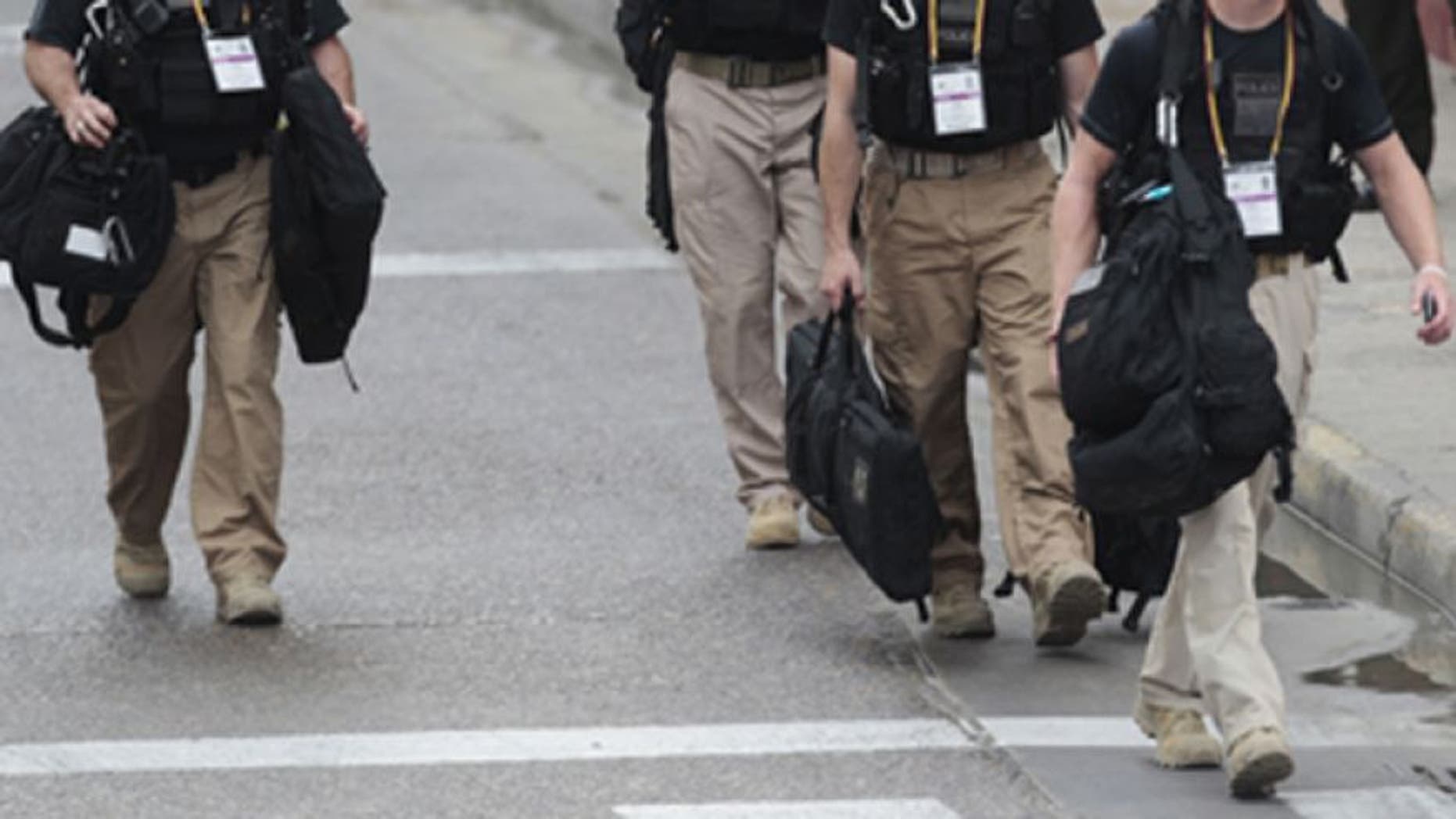 April 14, 2012: U.S. secret service agents walk around the Convention Center in Cartagena, Colombia, prior to the Summit of the Americas.