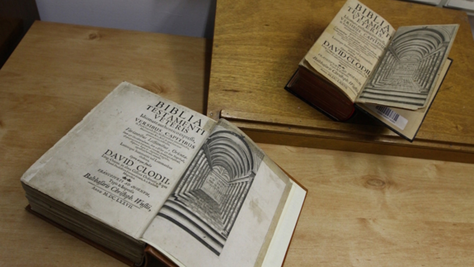 The twin Tanachim (the plural of Tanakh) are shown side by side, with the newfound copy on the bottom. As with all Hebrew books, they open from right to left.