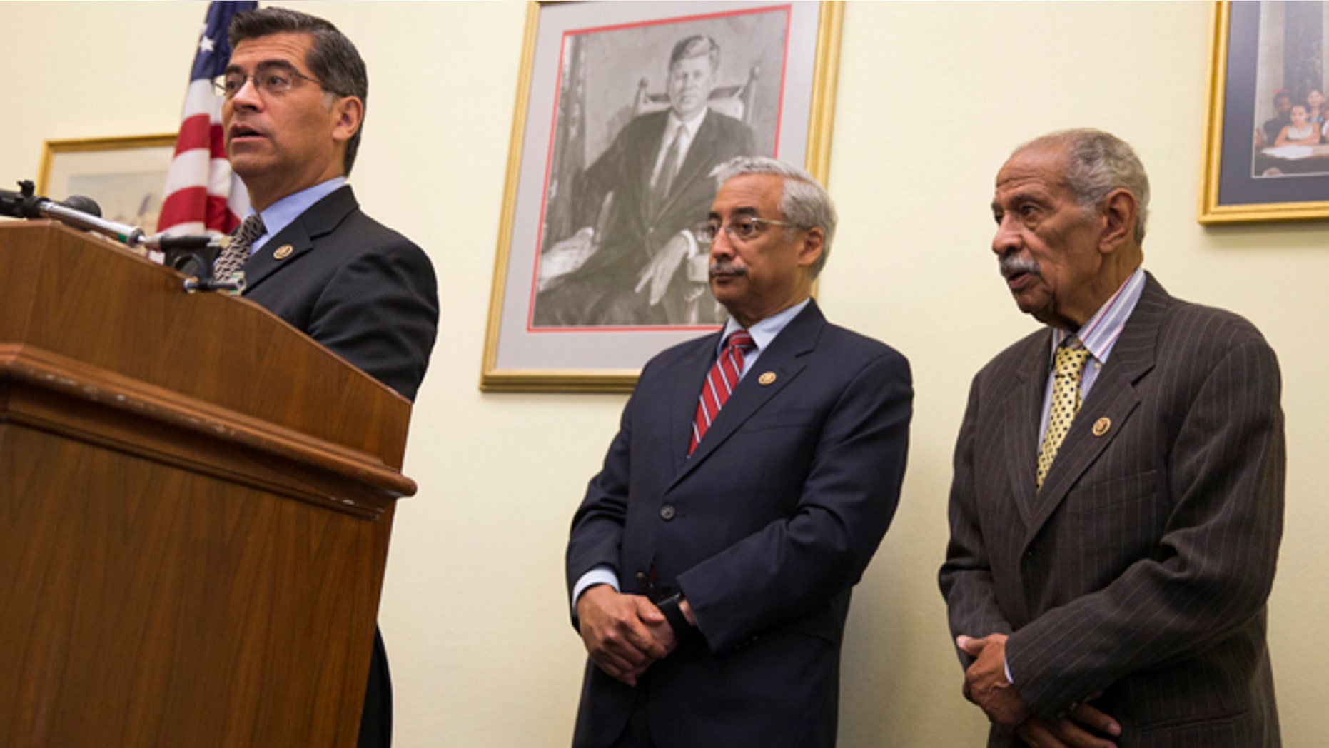 Rep. Xavier Becerra, D-Calif., left, accompanied by Rep. Bobby Scott, D-Va., ranking member on the House Education and the Workforce Committee, center, and Rep. John Conyers, D-Mich., speaks during a news conference on Capitol Hill in Washington, Tuesday, May 17, 2016. Six decades after the Supreme Court outlawed separating students by race, stubborn disparities persist in how the country educates its poor and minority children. A report Tuesday, May 17, 2016, by the nonpartisan Government Accountability Office found deepening segregation of black and Hispanic students nationwide, with a large increase among K-12 public schools. (AP Photo/Evan Vucci)