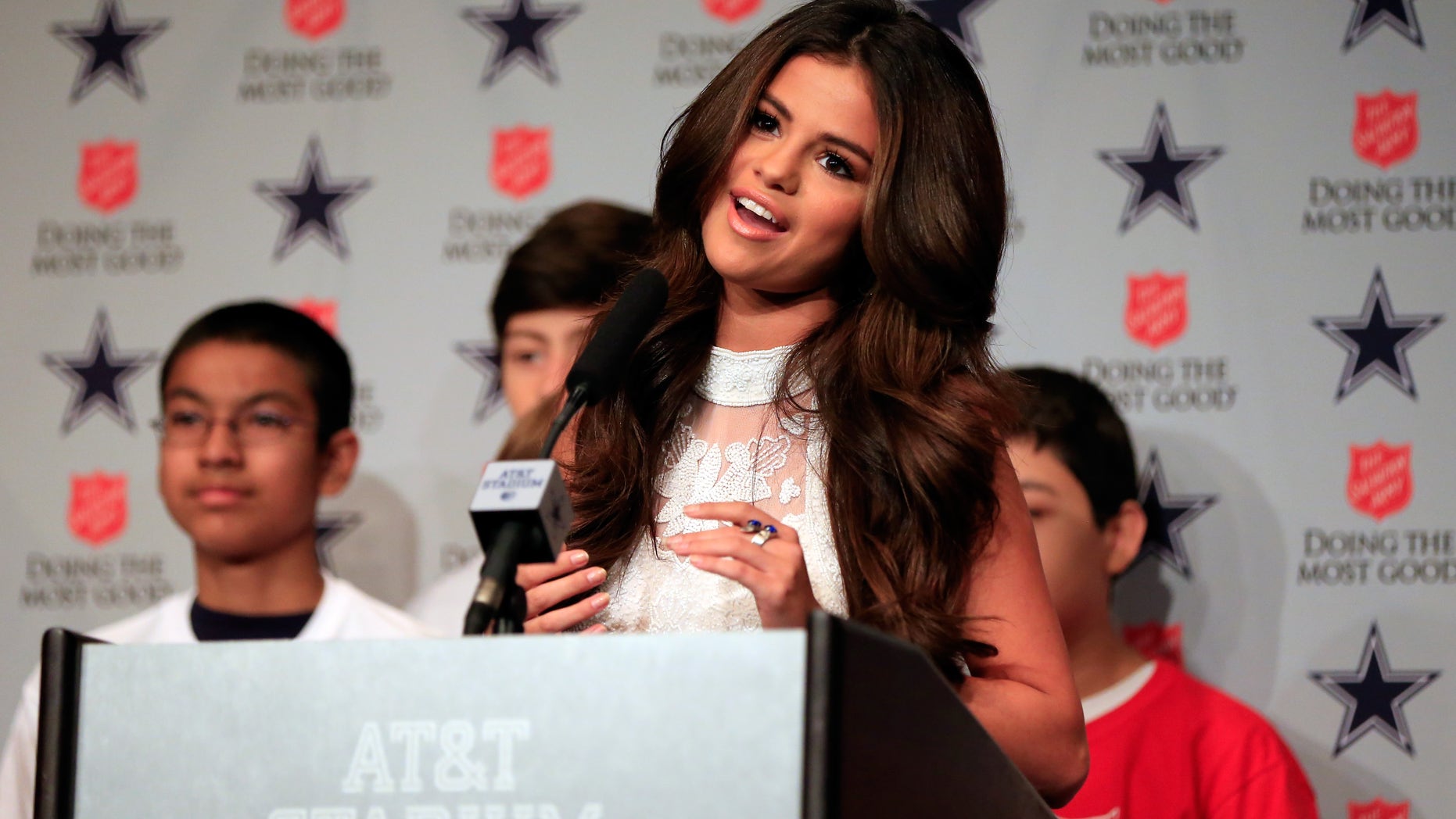 ARLINGTON, TX - NOVEMBER 03: Singer and actress Selena Gomez talks to the media after announcing she will be the halftime entertainment for the Dallas Cowboys on Thanksgiving day prior to the game at Cowboys Stadium on November 3, 2013 in Arlington, Texas. (Photo by Jamie Squire/Getty Images)