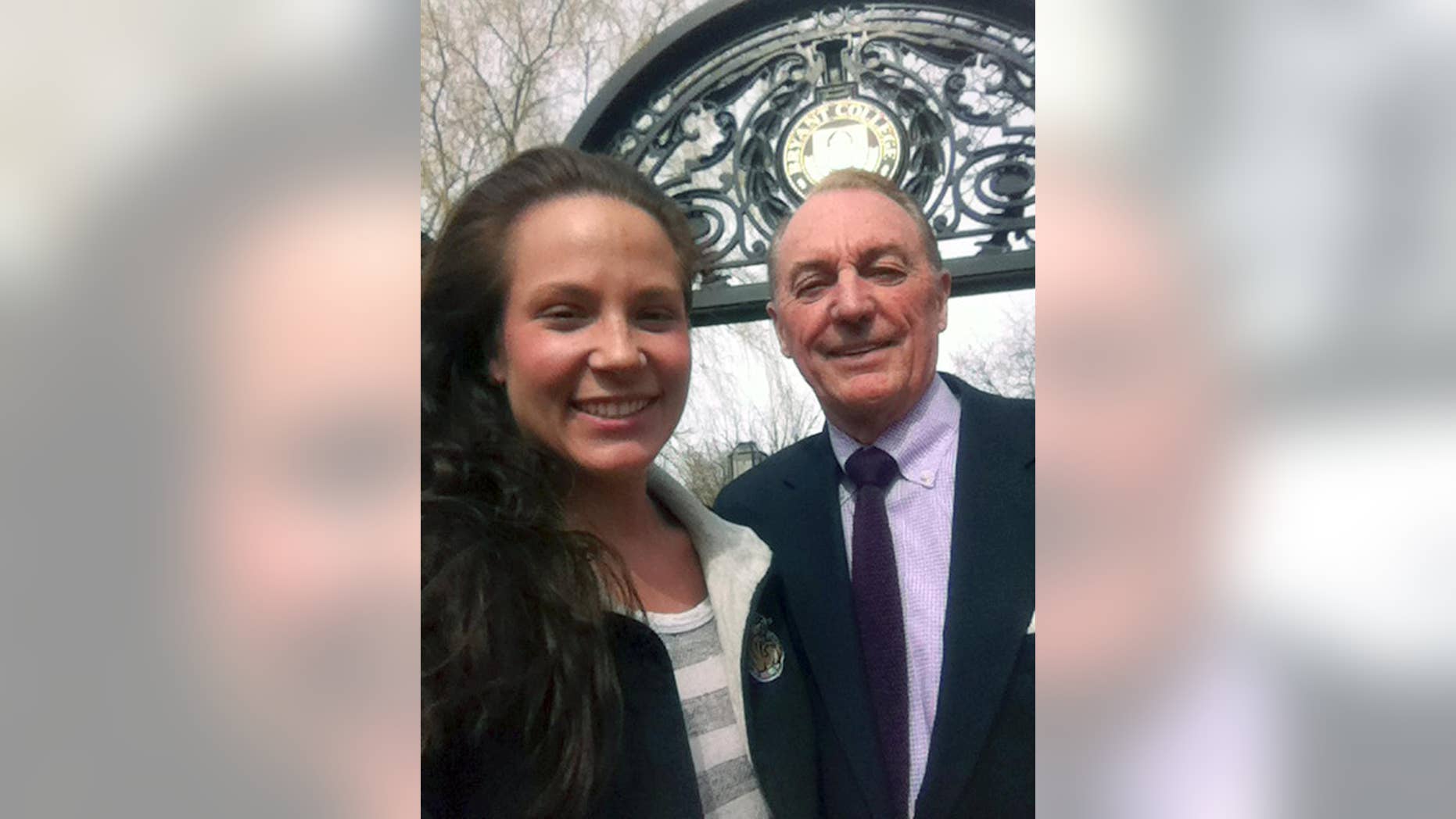 This photo taken and provided by Ali Luthman, left, of Worcester, Mass., shows her with Bryant University President Ronald Machtley on the school's campus in Smithfield, R.I. on Friday, April 18, 2104. Although Machtley, who is active on social media, loves posing for pictures with the students, the university has asked graduates to resist the urge to take a selfie with him when receiving their diploma this year, saying it will greatly prolong the graduation ceremony. Machtley says he is happy to take some after the service though. (AP Photo/Ali Luthman)