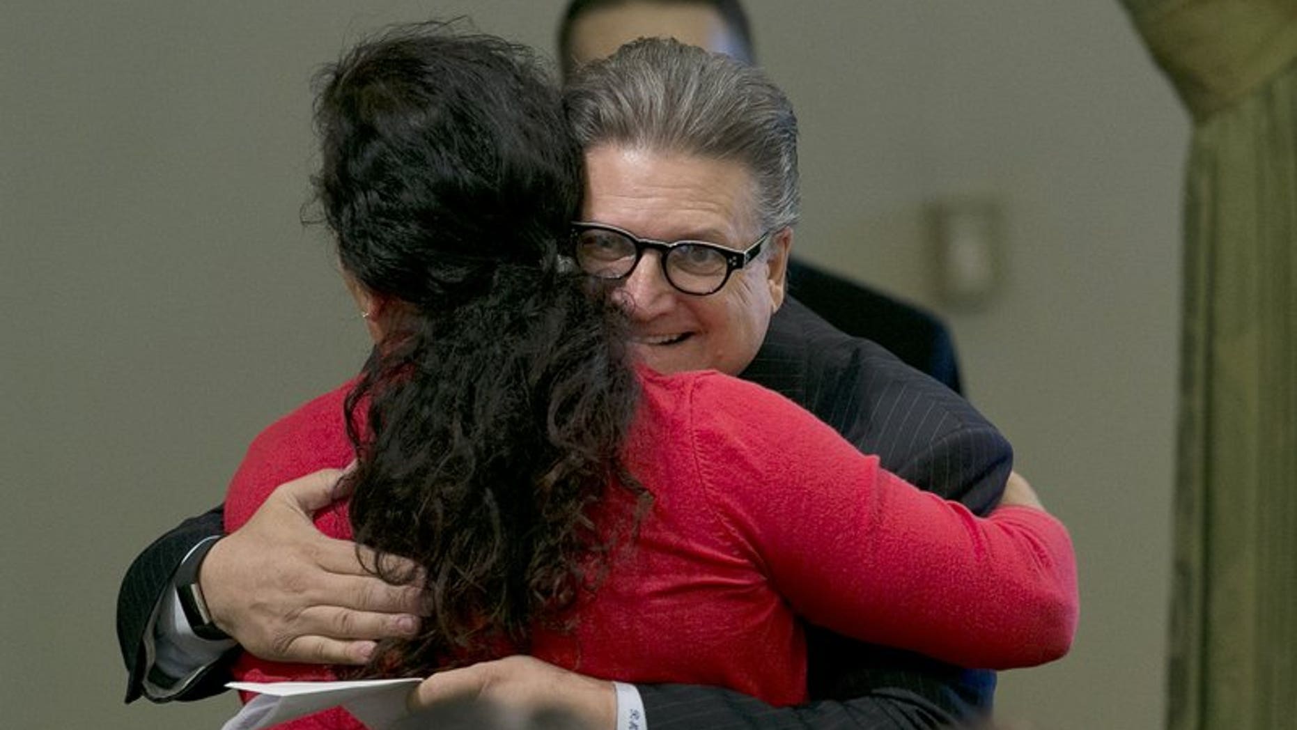California state Sen. Bob Hertzberg hugs Assemblywoman Lorena Gonzalez Fletcher, D-San Diego, after his storm water bill was approved by the Assembly in Sacramento, Calif., Aug. 31, 2017.