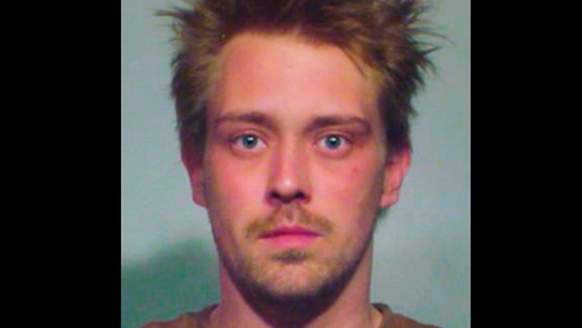 This undated photo provided May 20, 2012, by the Chicago Police Department shows Sebastian Senakiewicz, 24, of Chicago. Chicago police said Sunday, May 20, 2012, that Senakiewicz has been charged with one felony count of terrorism/making a false threat.
