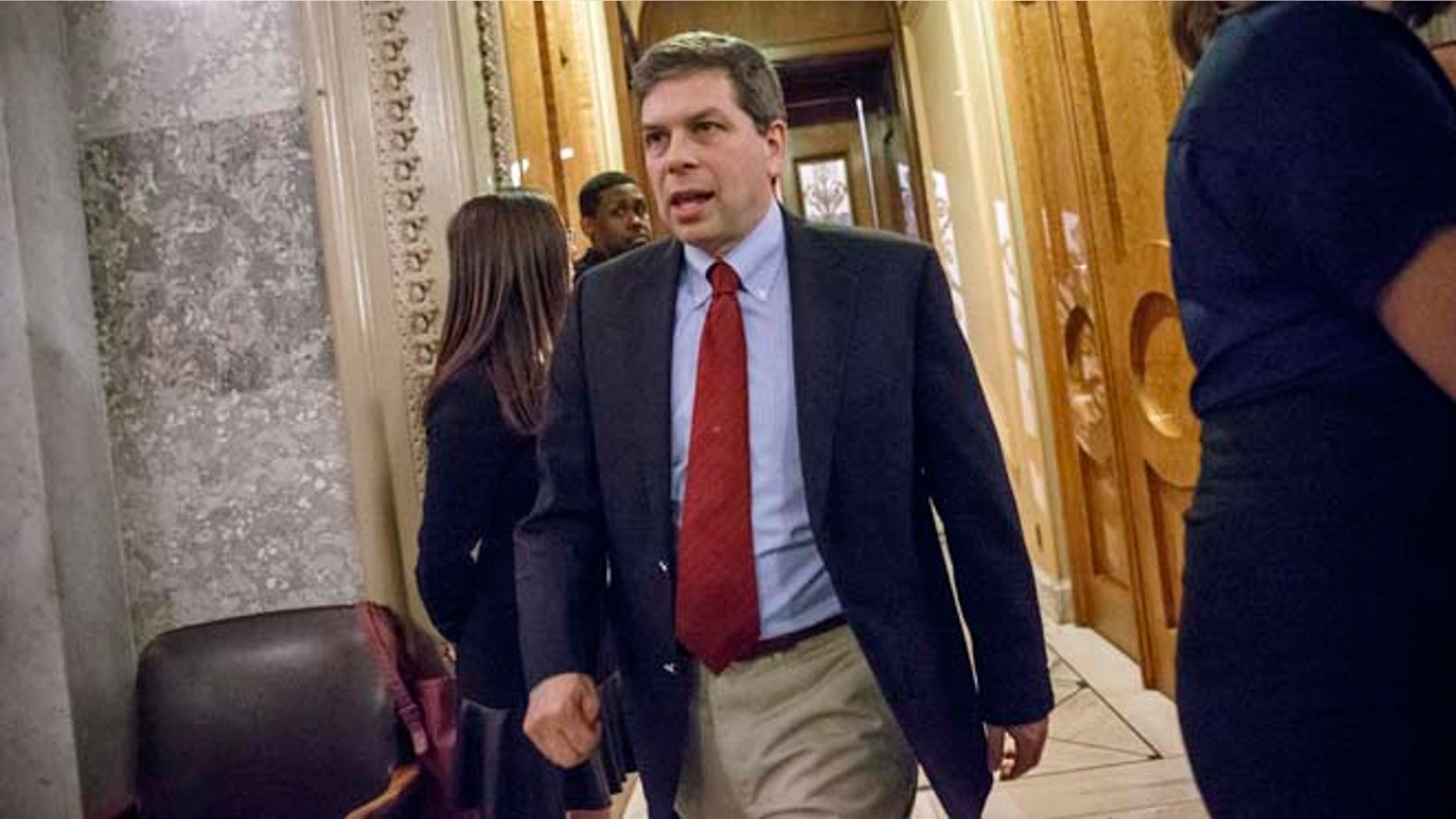 Nov. 12, 2014: Sen. Mark Begich, D-Alaska, leaves the Senate chamber after a roll call vote at the Capitol in Washington.
