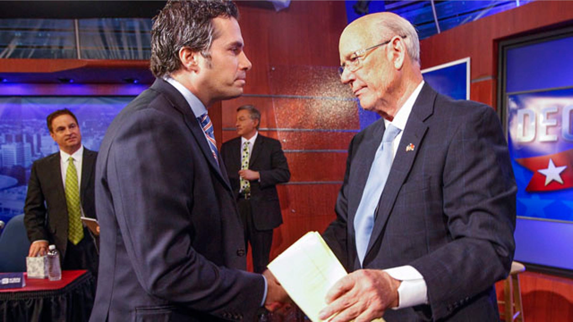 October 15, 2014: Independent candidate Greg Orman, left, shakes hands with Sen. Pat Roberts, R-Kan., following their debate in Wichita. (AP Photo/The Wichita Eagle, Fernando Salazar)