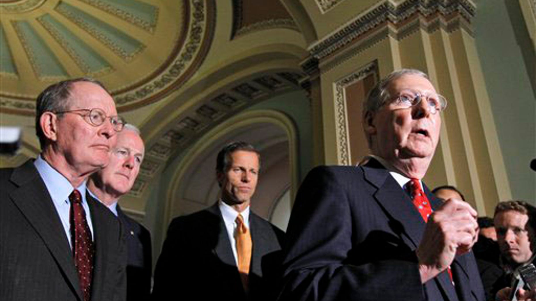 Senate Minority Leader Mitch McConnell of Ky., right, talks to reporters on Capitol Hill in Washington, Tuesday, Sept. 21, 2010, prior to the Senate vote on the defense authorization bill. From left are, Sen. Lamar Alexander, R-Tenn., Sen. John Cornyn, R-Texas, and Sen. John Thune, R-S.D., and McConnell.