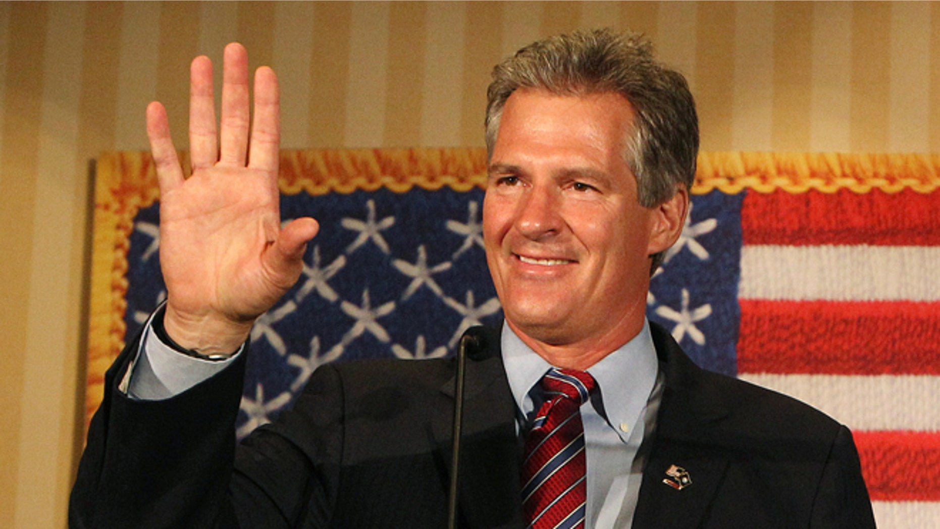 In this Tuesday, Sept. 9, 2014 photo, Scott Brown waves to supporters in Concord, N.H. after winning New Hampshire's Republican U.S. Senate primary.