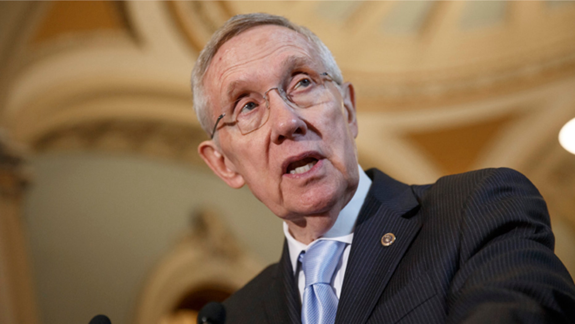 In this Sept. 16, 2014, file photo, Senate Majority Leader Harry Reid, D-Nev., speaks with reporters following a Democratic policy lunch at the Capitol in Washington.