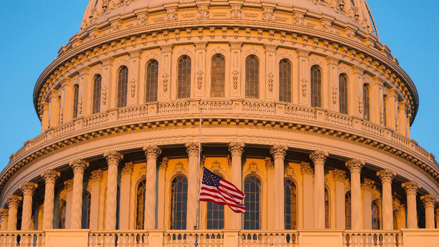 FILE - In this Sept. 16, 2013, file photo, the U.S. Capitol at sunset in Washington. Democrats and Republicans are fervently pursuing a batch of doomed bills in Congress because they target a coveted prize in the Nov. 4 elections: female voters. Wednesday, July 16's Senate vote on contraception legislation is the latest example of Democrats’ win-by-losing strategy, which forces Republicans to vote on sensitive matters that might rile women this fall. (AP Photo/J. Scott Applewhite, File)