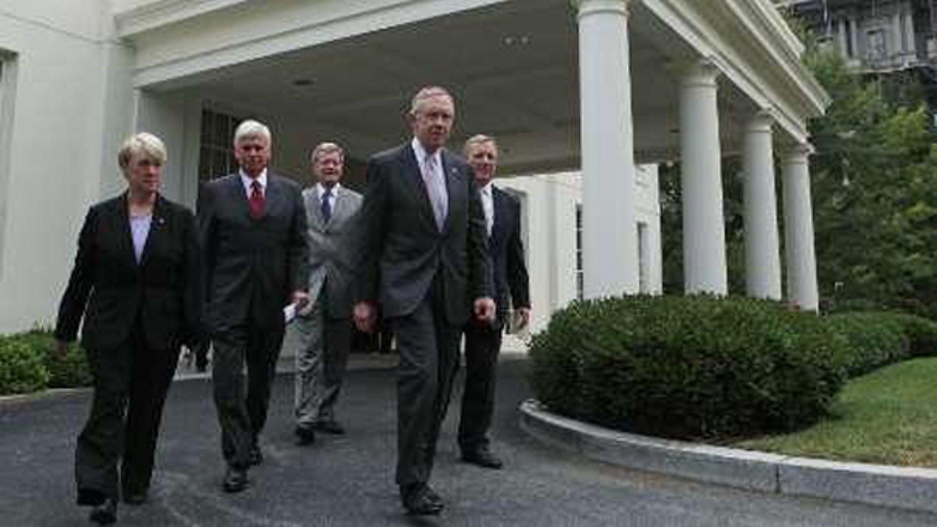 Democratic Senators walk out of the West Wing after meeting with President Barack Obama about healthcare legislation at the White House in Washington, August 4, 2009. (Reuters)