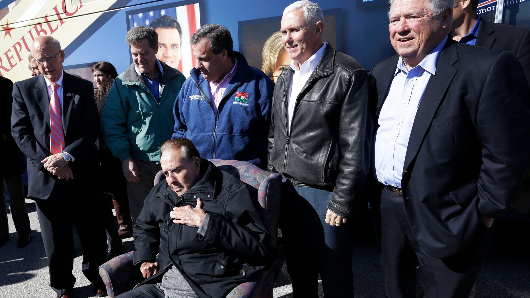 Oct. 31, 2014: Former Sen. Bob Dole, R-Kan., seated, is backed by Sen. Pat Roberts, R-Kan., from left, Gov. Sam Brownback, New Jersey Gov. Chris Christie, Indiana Gov. Mike Pence and former Mississippi Gov. Haley Barbour during a campaign stop in Kansas City, Kan.