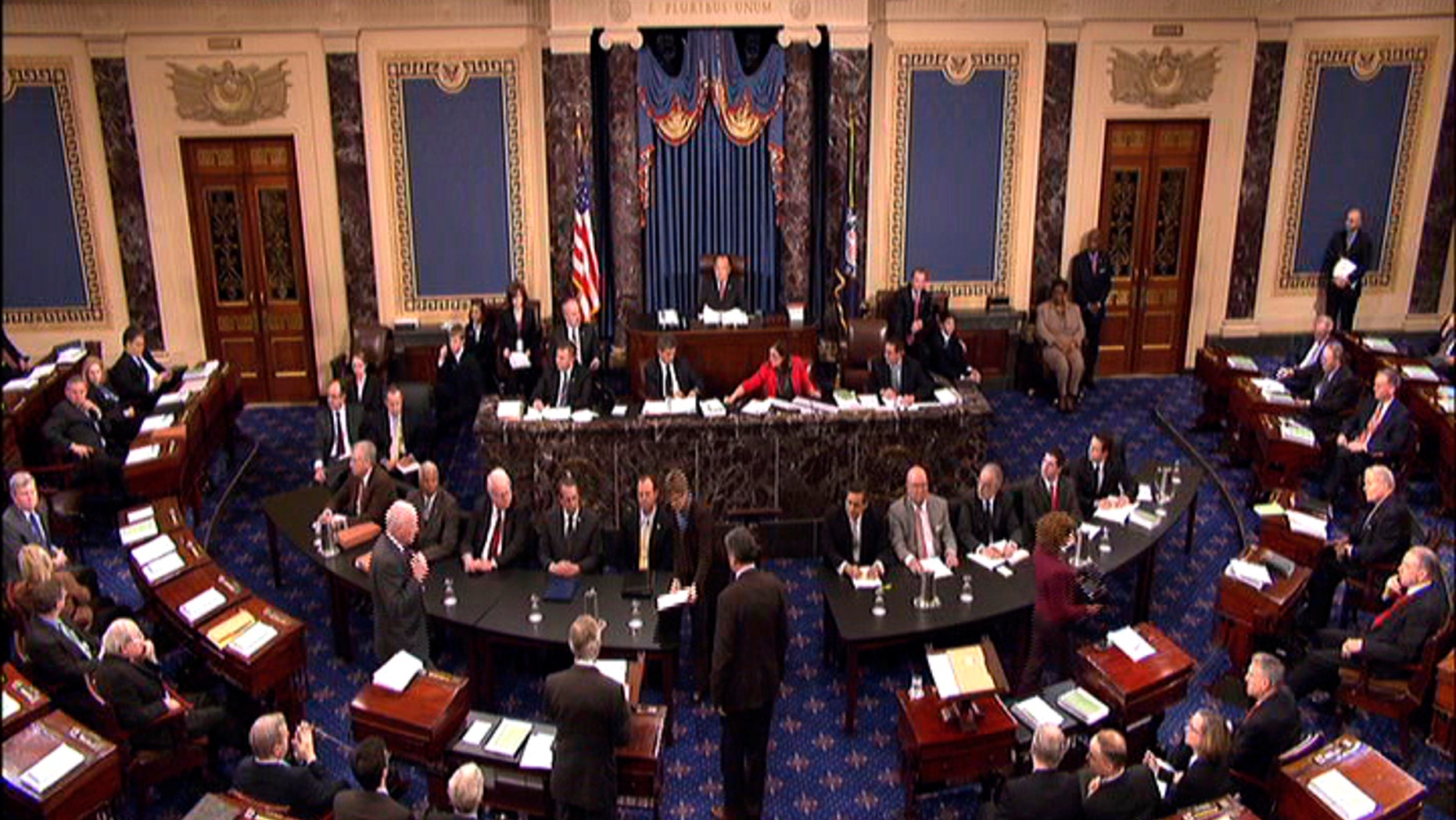 This video frame grab image provided by Senate Television shows the Senate impeachment trial of Judge G. Thomas Porteous, seated, table at right, facing camera, second from left. The attorney Porteous, facing a rare impeachment trial before the Senate argued Tuesday that Congress would be breaking with precedent by considering many of the charges against him. (AP Photo/Senate Television)
