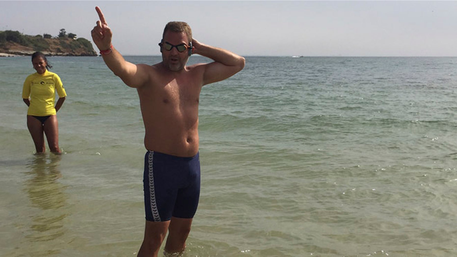Ben Hooper, 38, a former policeman from, United Kingdom gesture before his Swimming expedition across the Atlantic in Dakar, Senegal, Sunday, Nov. 13, 2016. Ben Hooper has been planning to make the epic endeavour for more than three years to become the first person to swim the full 1,635 nautical miles from Senegal to Brazil. (AP Photo/Carley Petesch)