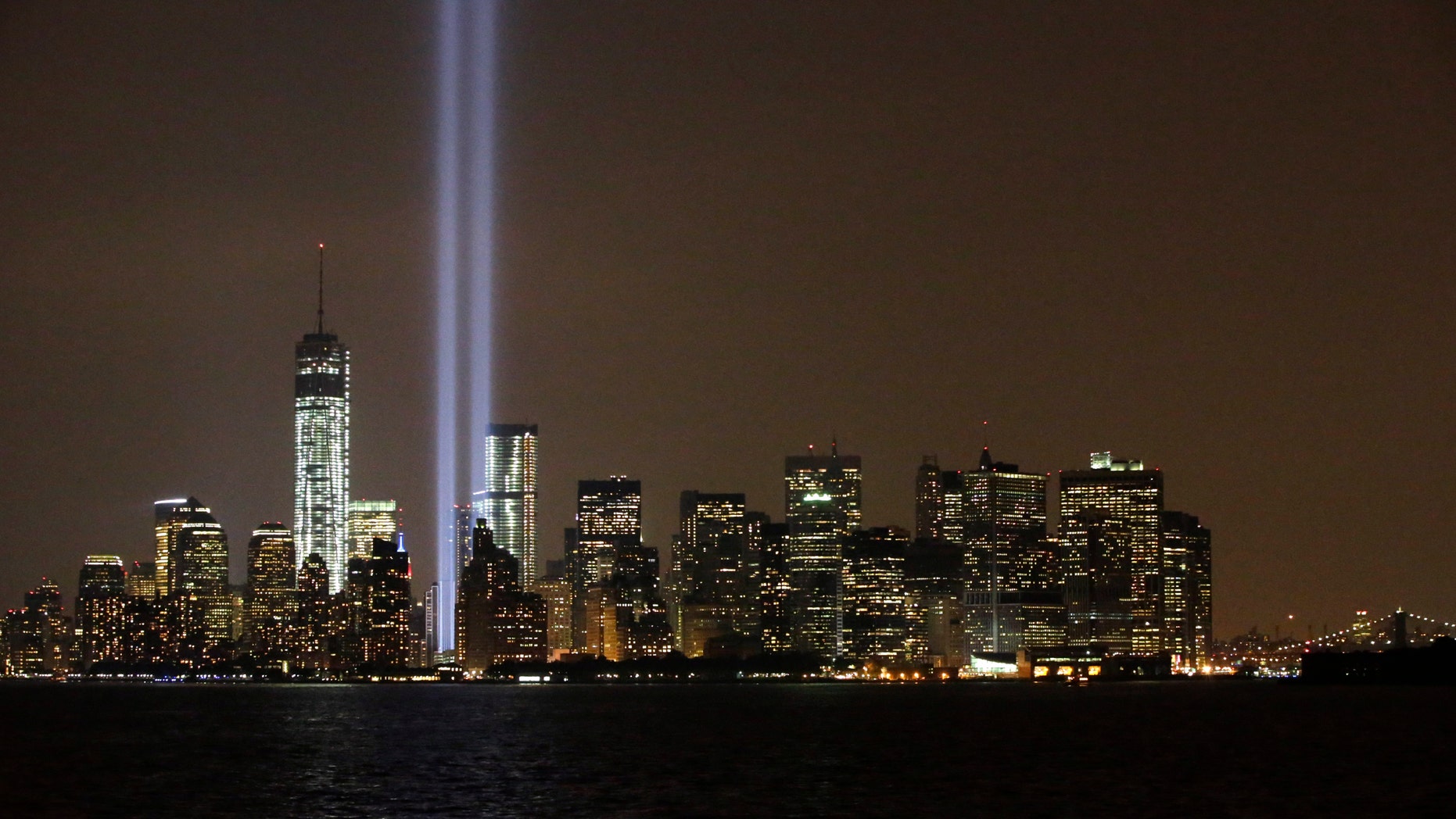 The twin beams of the annual Tribute in Light commemorating the September 11, 2001 terrorist attacks shine above the city';s skyline Wednesday, Sept. 11, 2013, in New York, on the 12th anniversary of the attacks.