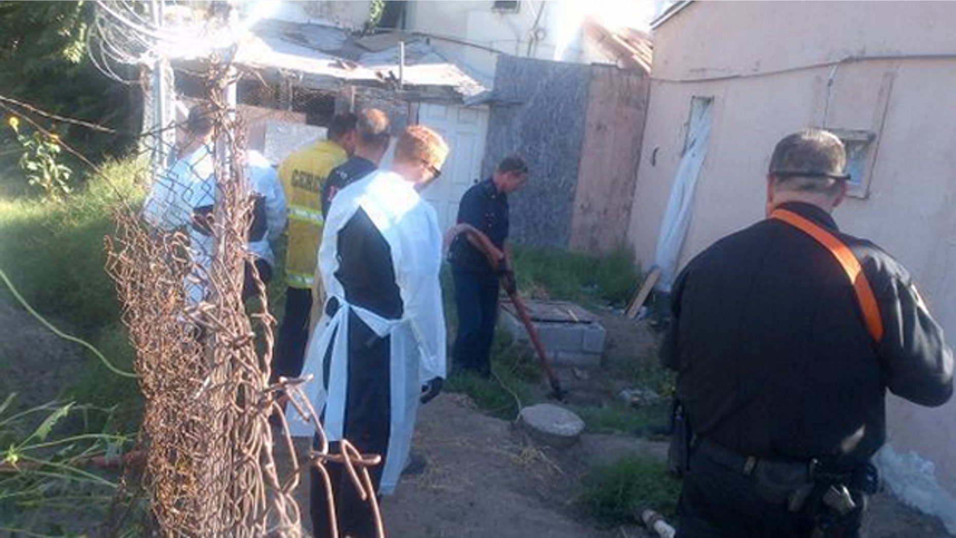 Firefighters in Ceres work to rescue a man that jumped into a septic tank in order to hide from sheriff's deputies.