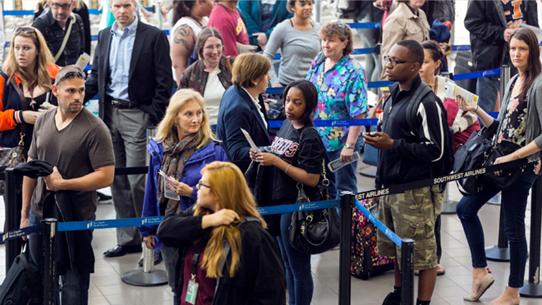 April 22: Travelers stand in line at Los Angeles International airport in Los Angeles.