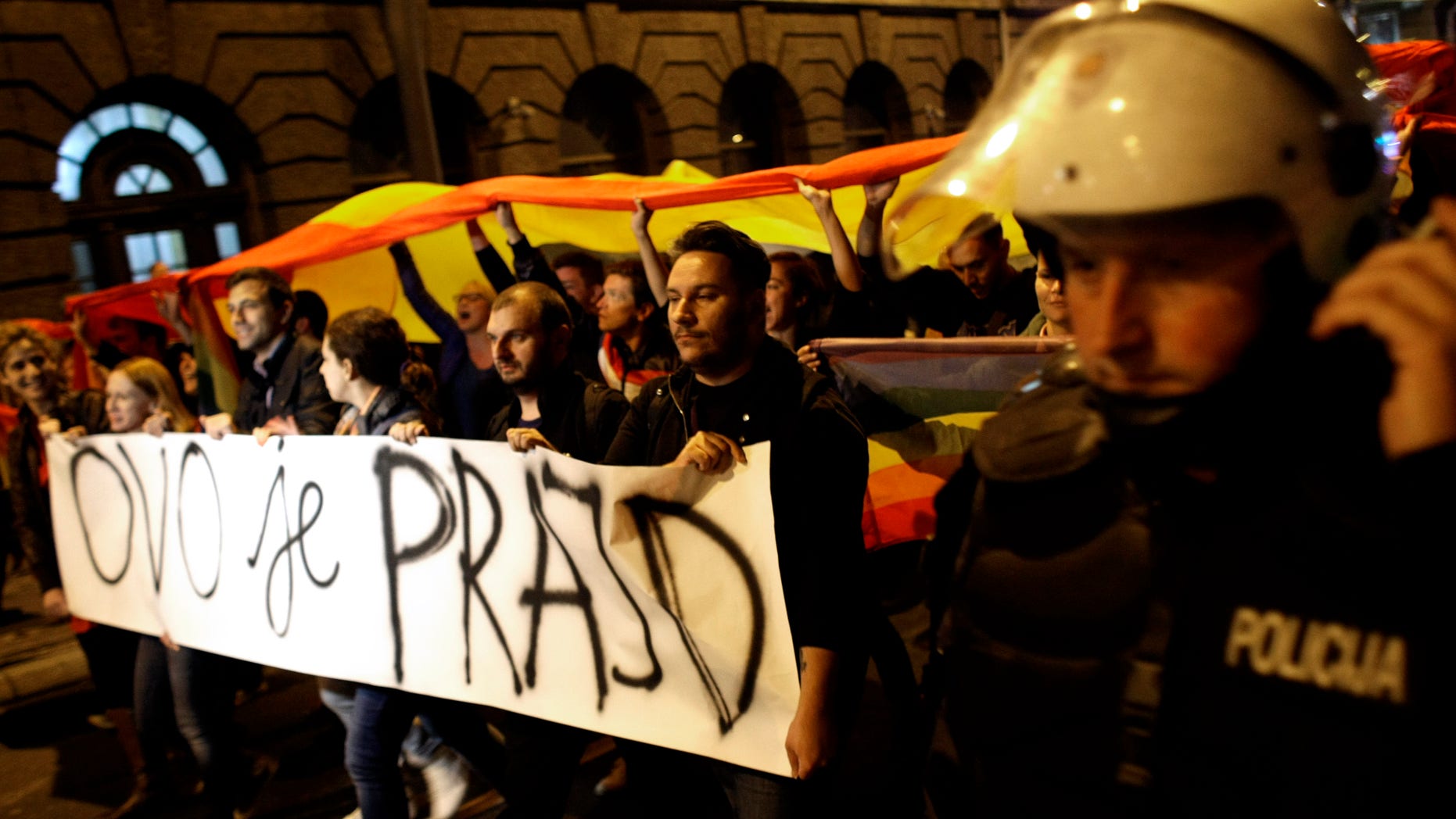 Sept. 27, 2013: Gay rights activists hold up a large rainbow flag and a banner reading "This is the Pride"; during a protest in Belgrade, Serbia.