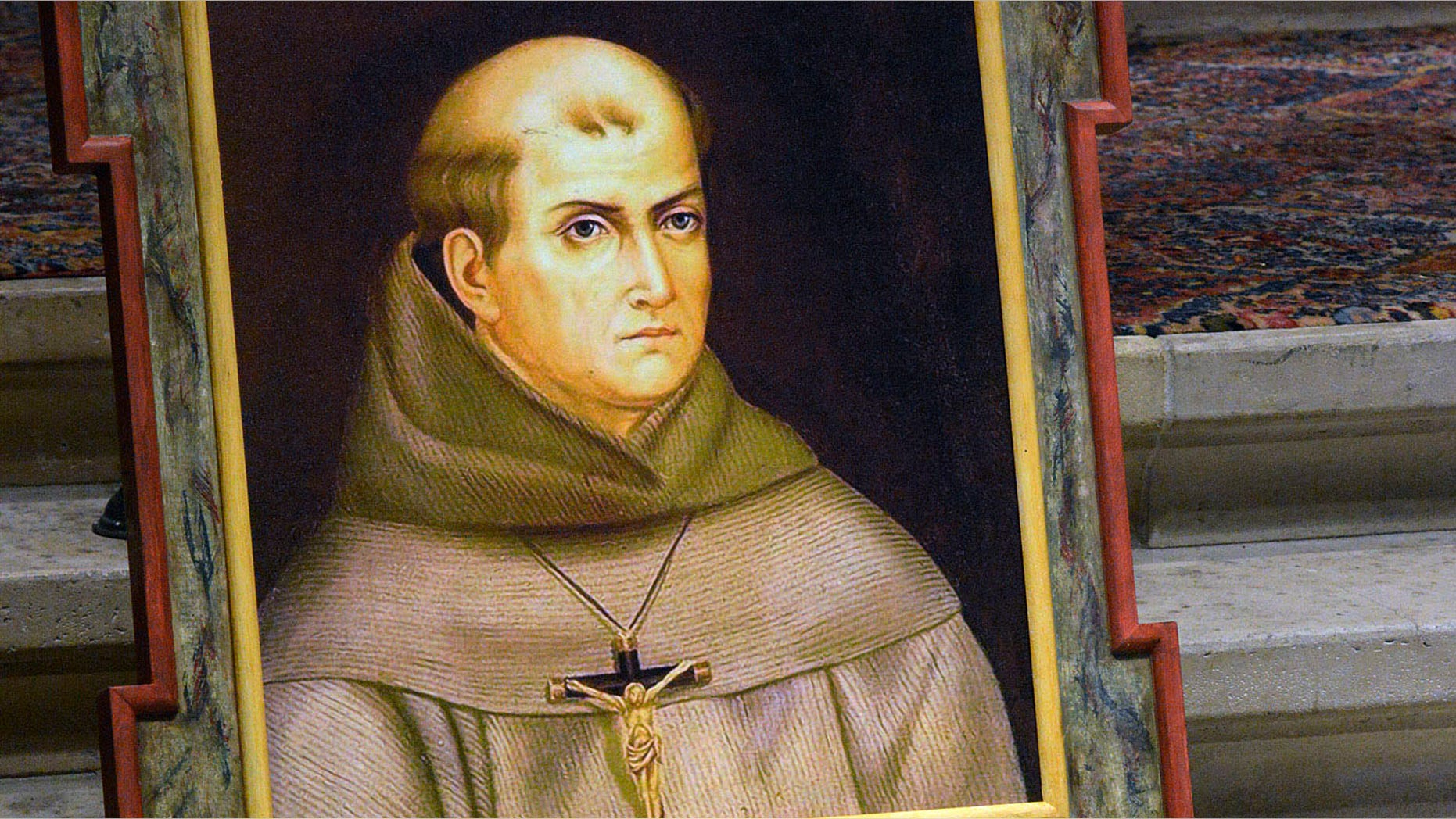 FILE - In this May 6, 2015 file photo, a painting of Rev. Junipero Serra is seen above his grave inside the basilica at the Carmel Mission in Carmel, Calif. Pope Francisâ apology for the Roman Catholic Churchâs crimes against indigenous peoples has not softened opposition among some California Native Americans to his decision to canonize 18th-century Franciscan missionary Junipero Serra, extolled by the Vatican as a great evangelizer, but denounced by some tribal officials as a destroyer of Native culture.(David Royal/The Monterey County Herald via AP, File) MANDATORY CREDIT