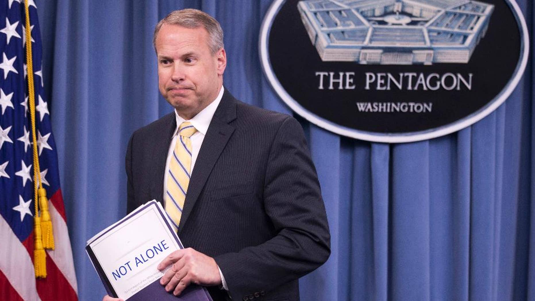 FILE - In this May 1, 2014 file photo, Nate Galbreath, Senior Executive Adviser for the Department of Defense Sexual Assault Prevention and Response Office (SAPRO), leaves a news conference at the Pentagon. Shocked and offended by explicit questions, some U.S. servicemen and women are complaining about a new sexual-assault survey that hundreds of thousands were asked to complete. The survey is conducted every two years, but this year’s version, developed by the Rand Corp., includes three pages of questions that detail numerous sexual acts. (AP Photo/Manuel Balce Ceneta, File)