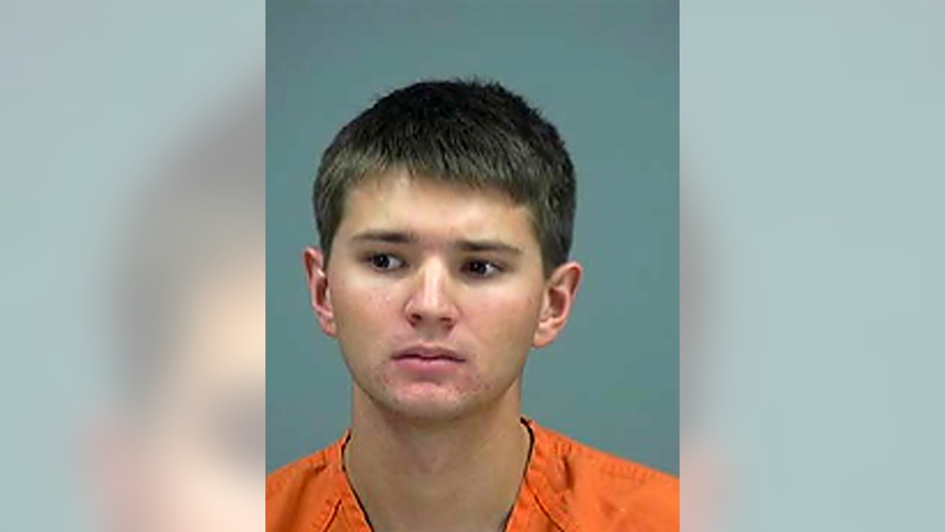 This police booking photo provided by Pinal County Sheriff's Office shows Tyler Kost from Pinal County, Ariz. Kost, 18, is accused of being a serial sex predator who allegedly targeted fellow high school students has been re-arrested. Officials say sheriff's detectives arrested Kost on Thursday, May 1, 2014, on new allegations that include additional cases reported after his initial arrest. Sheriff Paul Babeu says there are 18 reported victims so far and that other cases may remain unreported. Kost was released on $10,000 bond after being arrested Monday on suspicion of two counts each of sexual assault and sexual misconduct with a minor. (AP Photo/Pinal County Sheriff)