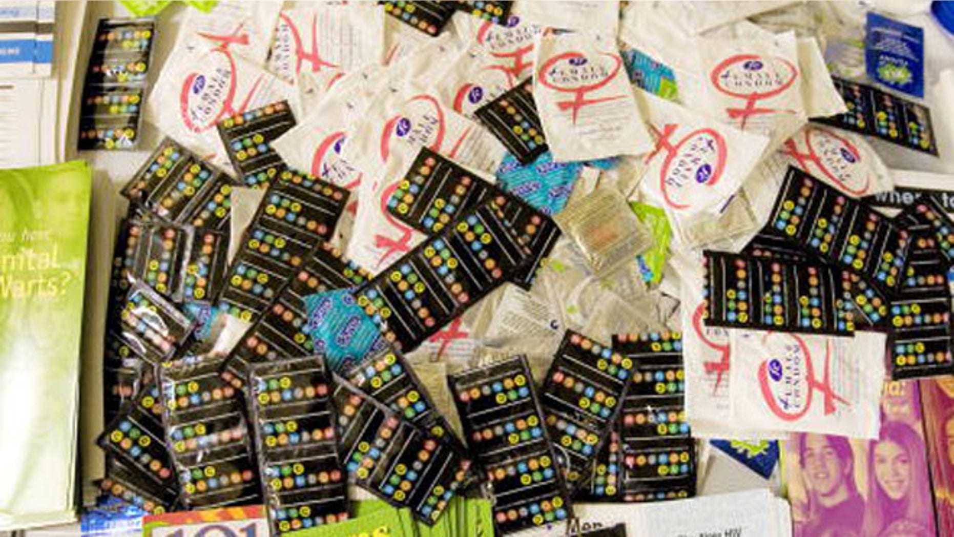 NEW YORK - NOVEMBER 30:Male and female condoms as well as help and assistance pamphlets rest on a table at the Iris House November 30, 2007 in New York CIty.The World Health Organization who started World AIDS Day promotes awareness and focus on the global AIDS epidemic. In 2007, the estimated number of persons living with HIV worldwide was 33.2 million and there were 2.1 million AIDS deaths.(Photo by Stephen Chernin/Getty Images)