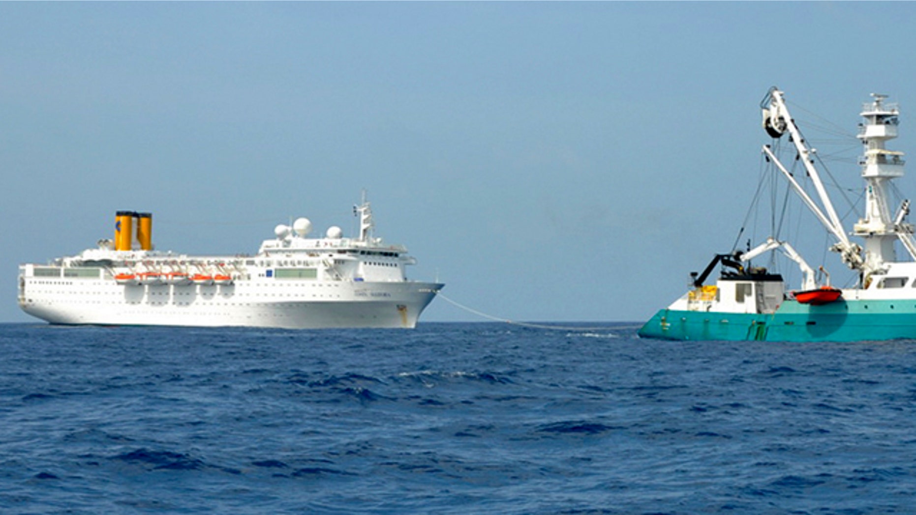 Feb. 28: In this photo taken by a member of French fishing vessel, The Talenduic, and provided by the Prefecture of the Reunion Island, shows the Italian cruise ship, The Costa Allegra, left, being towed by French fishing vessel, The Trevignon, in the Indian Ocean.