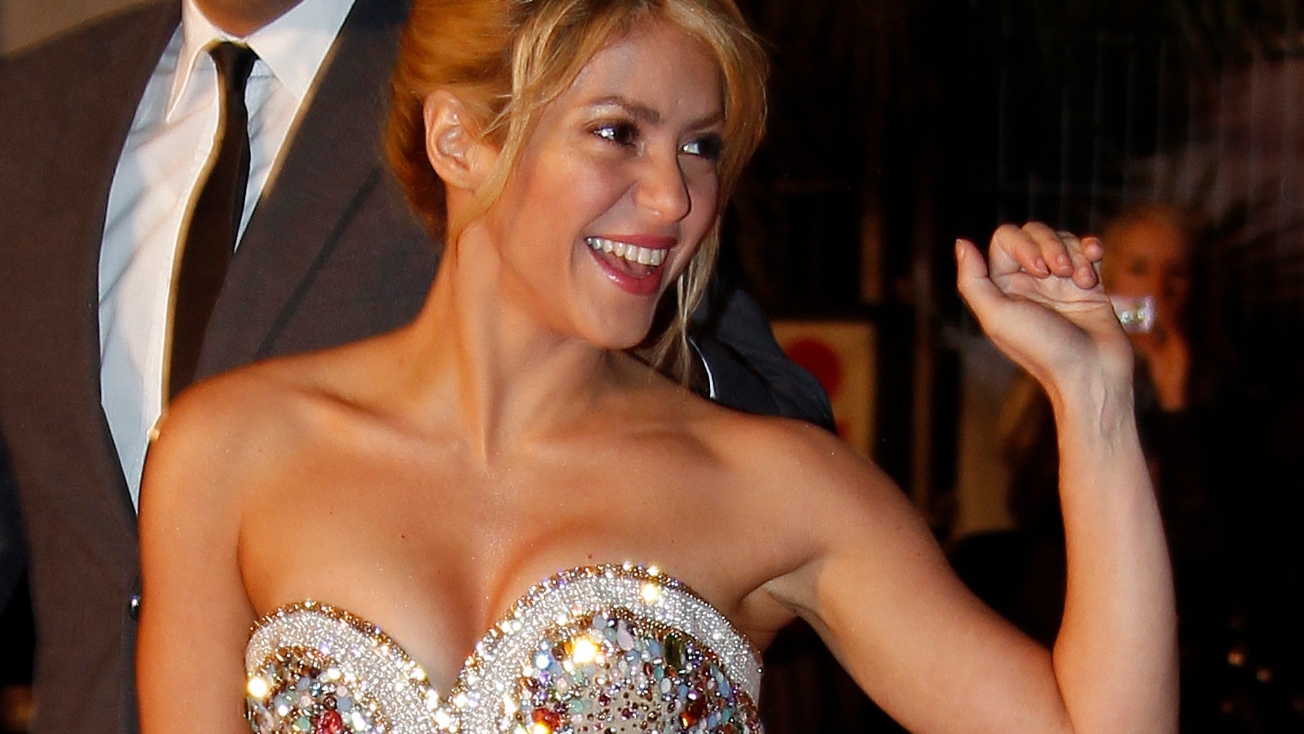 Colombian singer Shakira waves as she arrives at the Cannes festival palace to attend the NRJ Music Awards in Cannes January 28,2012.