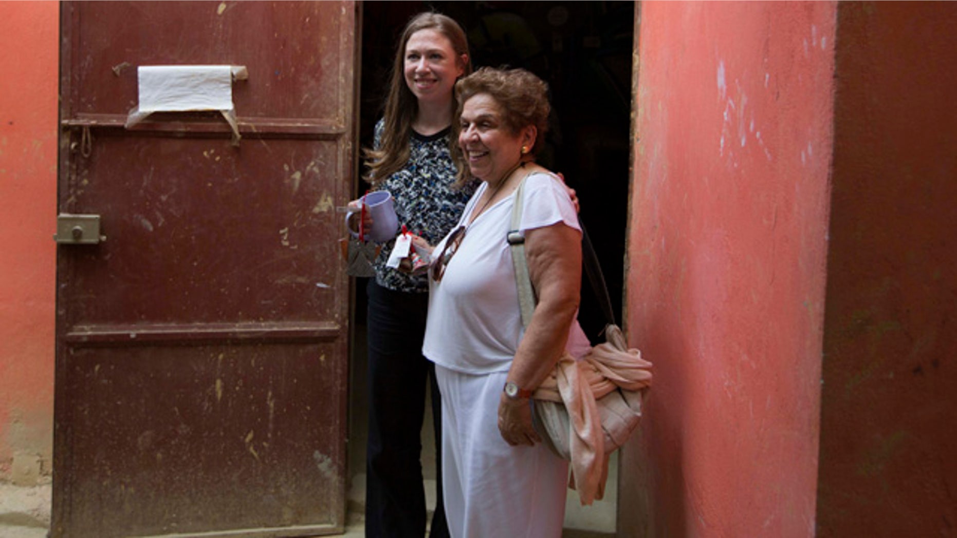 FILE - In this July 28, 2015, file photo, Chelsea Clinton, left, poses for a picture with Donna Shalala, Clinton Foundation President at Papillon Enterprise, in Port-au-Prince, Haiti. (AP Photo/Dieu Nalio Chery, File)