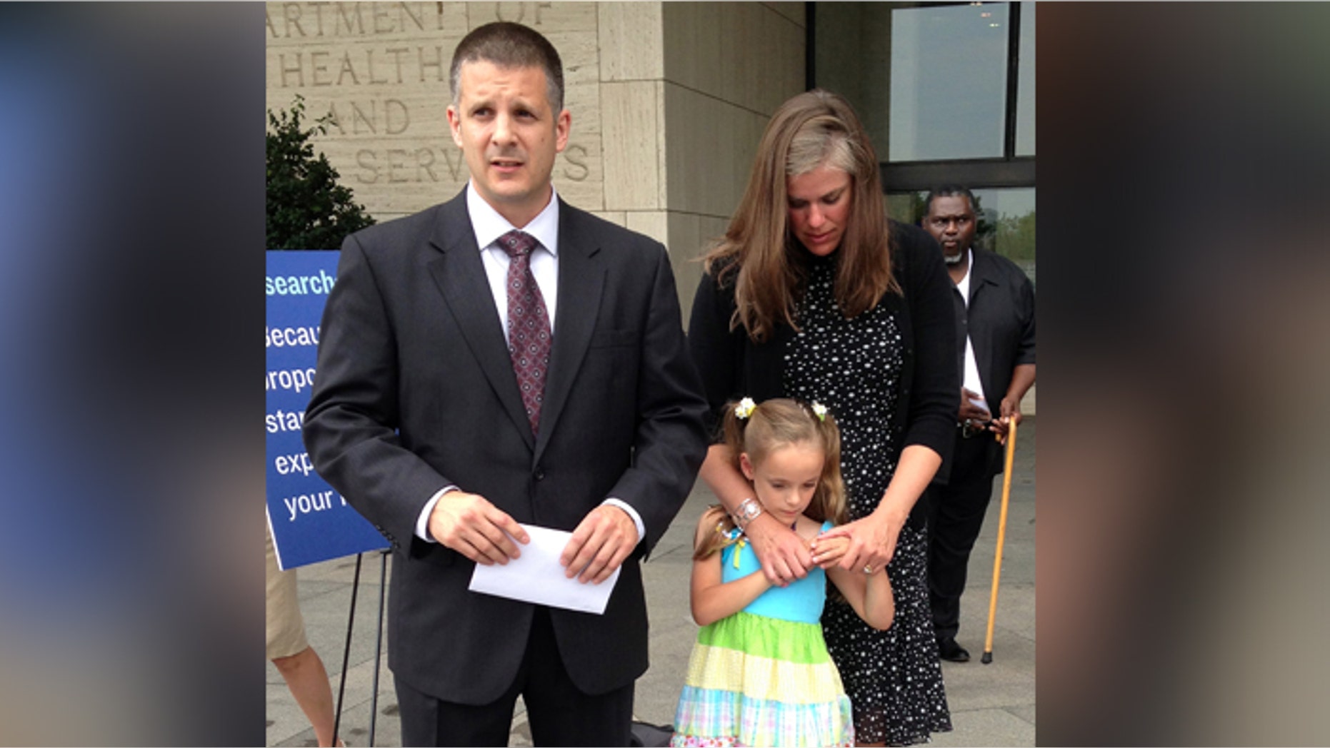 Shawn and Carrie Pratt of Kingwood, W.Va., with their daughter Dagen, speak to the media outside a federal health meeting in Washington. Dagen was part of a controversial study of premature babies that has sparked questions about how to inform patients about the risks of medical research.
