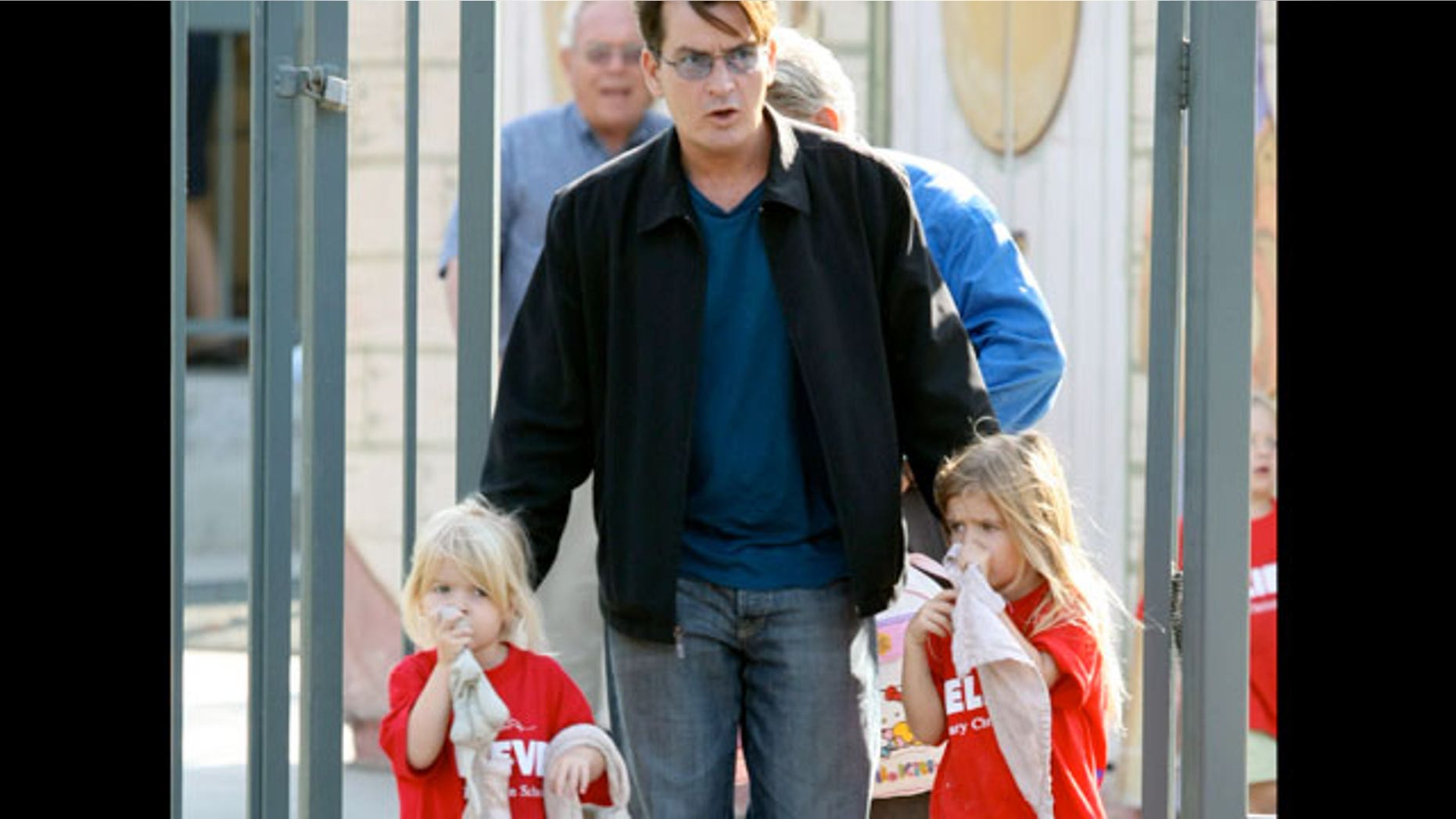 Charlie Sheen is seen here with his two daughters in this 2009 photo. (X17 Online)